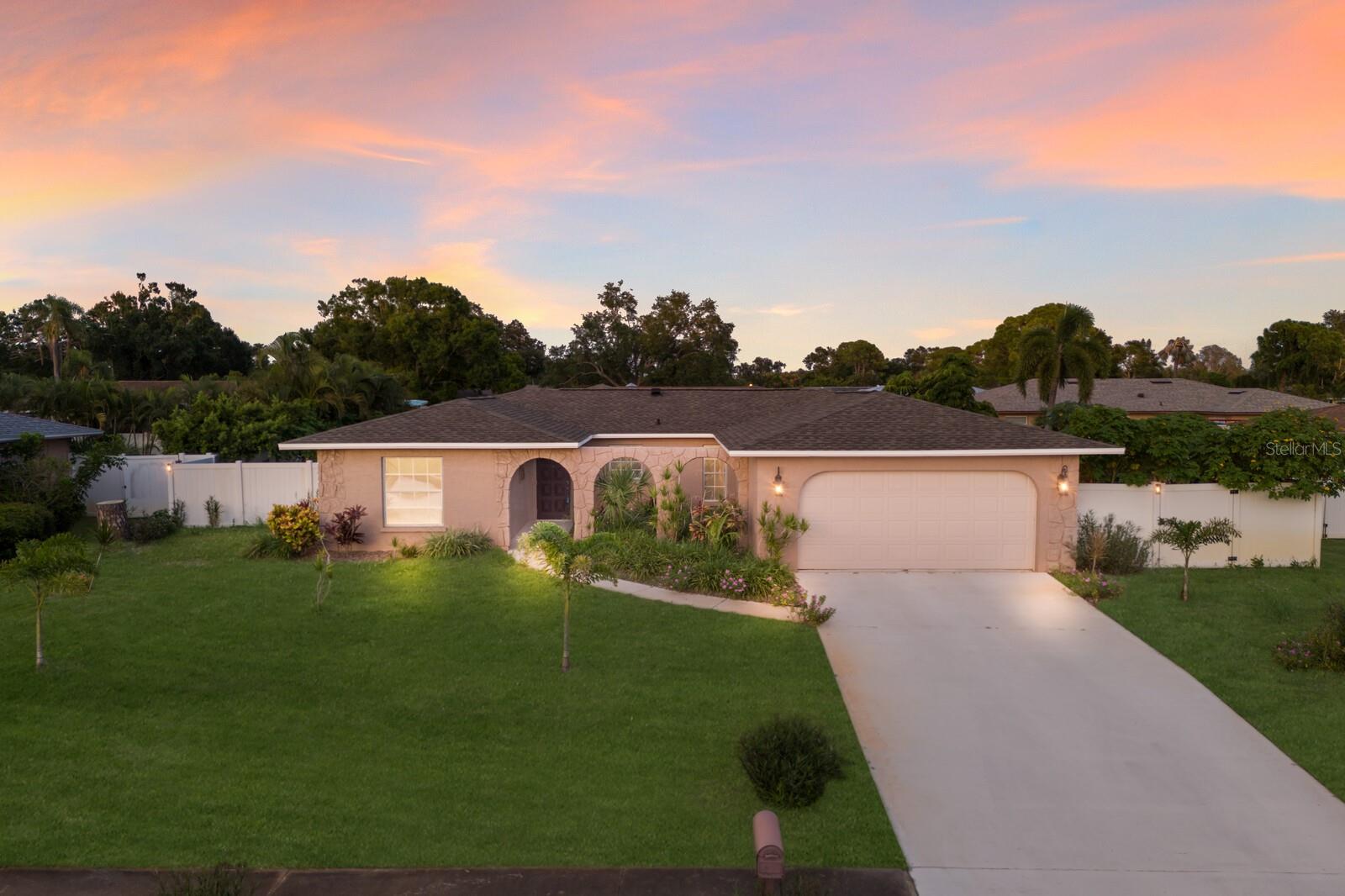 Welcome to this beautifully maintained 3-bedroom, 2-bathroom home nestled in the desirable Pine Lakes community. With a NEW ROOF (2022) and NEW AC (2021), this move-in-ready gem offers peace of mind from the start. Situated on nearly a quarter acre with no HOA, no CDD, and no flood insurance required, it’s a rare find in a central location. Step inside to find easy-to-maintain tile flooring throughout the main living areas, and a well-appointed kitchen featuring white cabinetry with charming glass-front accents, recessed lighting, and dual closet pantries for ample storage. The split-bedroom floorplan provides privacy and comfort, with the owner’s suite boasting an updated en-suite bathroom with a walk-in shower and French doors leading out to the spacious screened-in lanai—your own private retreat. The second bathroom has also been stylishly updated with a vessel sink and glass-enclosed shower. French doors off the living room open to the lanai and lead to a fully fenced backyard, perfect for enjoying Florida’s sunshine year-round. An open patio space offers the ideal spot for entertaining, and the irrigation system with well and pump keeps your lawn lush and green with ease. Located just minutes from top-rated schools, hospitals, dining, shopping, boat launches, and world-renowned beaches like Anna Maria Island, Bradenton Beach, and Siesta Key—this home truly sits at the heart of it all. With easy access to IMG Academy, Benderson Park, UTC Mall, and just a short drive to Tampa or Disney, this property is perfect as your primary residence or a flexible Florida getaway. Don't miss the opportunity to make it yours!
