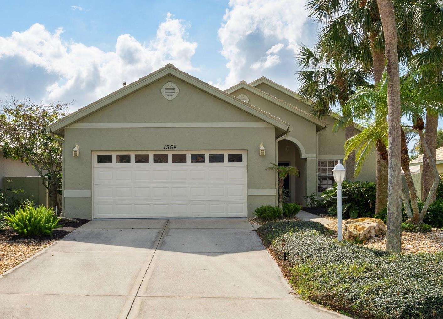 This well-built and meticulously cared-for Waterford Carina model offers spacious living, abundant natural light, and exceptional outdoor space in a quiet, gated community of just 39 homes. Located in maintenance-free Berkshire Place, this 1,796 sq. ft. home features 2 bedrooms, 2 baths, and a versatile den—ideal for a home office or guest space.
Designed for comfort and functionality, the open floor plan showcases cathedral ceilings, pocket doors, and a seamless mix of engineered hardwood, tile, and laminate flooring. The kitchen offers quartz countertops, a tile backsplash, refinished cabinetry, a stainless-steel double sink, and a large pantry. A pass-through window connects to the lanai, making entertaining effortless.
The primary suite is a private retreat with a custom walk-in closet and impact-resistant sliding doors to the lanai. The en-suite bath features granite countertops, a walk-in shower with seamless glass doors, a garden tub, and cathedral ceilings. A well-appointed guest bedroom and bath provide comfortable accommodations for visitors.
Outdoor living is a highlight, with a spacious covered lanai and wraparound stone patio, extending the outdoor space to 2,100 sq. ft. Enjoy ceiling fans, tile flooring, ambient lighting, and an extended quartz counter with cabinetry—perfect for relaxing or entertaining. Impact windows and doors provide peace of mind and energy efficiency.
Low HOA fees cover lawn care, tree trimming, irrigation, and access to Waterford’s exclusive amenities, including a Jr. Olympic-sized pool, Har-Tru tennis courts, fitness center, clubhouse, and social activities. With no CDD fees or capital contribution at closing, this home is an excellent value.
Centrally located near Venice’s beaches, Wellen Park, I-75, Legacy Trail, Sarasota Memorial Hospital, shopping, dining, and golf, this move-in-ready home is perfect as a primary residence or seasonal retreat.