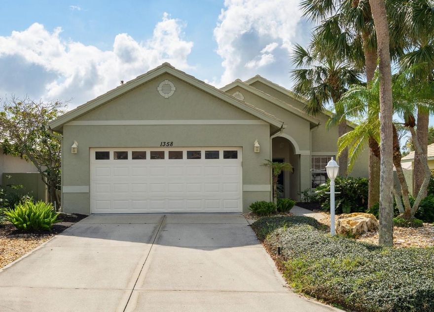 This well-built and meticulously cared-for Waterford Carina model offers spacious living, abundant natural light, and exceptional outdoor space in a quiet, gated community of just 39 homes. Located in maintenance-free Berkshire Place, this 1,796 sq. ft. home features 2 bedrooms, 2 baths, and a versatile den—ideal for a home office or guest space.
Designed for comfort and functionality, the open floor plan showcases cathedral ceilings, pocket doors, and a seamless mix of engineered hardwood, tile, and laminate flooring. The kitchen offers quartz countertops, a tile backsplash, refinished cabinetry, a stainless-steel double sink, and a large pantry. A pass-through window connects to the lanai, making entertaining effortless.
The primary suite is a private retreat with a custom walk-in closet and impact-resistant sliding doors to the lanai. The en-suite bath features granite countertops, a walk-in shower with seamless glass doors, a garden tub, and cathedral ceilings. A well-appointed guest bedroom and bath provide comfortable accommodations for visitors.
Outdoor living is a highlight, with a spacious covered lanai and wraparound stone patio, extending the outdoor space to 2,100 sq. ft. Enjoy ceiling fans, tile flooring, ambient lighting, and an extended quartz counter with cabinetry—perfect for relaxing or entertaining. Impact windows and doors provide peace of mind and energy efficiency.
Low HOA fees cover lawn care, tree trimming, irrigation, and access to Waterford’s exclusive amenities, including a Jr. Olympic-sized pool, Har-Tru tennis courts, fitness center, clubhouse, and social activities. With no CDD fees or capital contribution at closing, this home is an excellent value.
Centrally located near Venice’s beaches, Wellen Park, I-75, Legacy Trail, Sarasota Memorial Hospital, shopping, dining, and golf, this move-in-ready home is perfect as a primary residence or seasonal retreat.