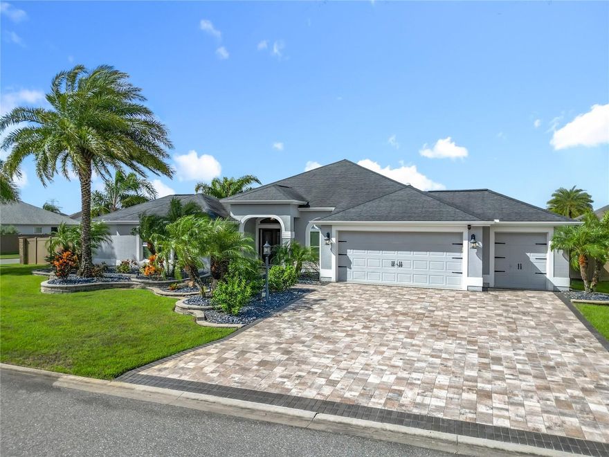 Discover a rare pool home with a fenced-in yard in The Village of Pine Hills! This custom, expanded Gardenia Split Floor Plan features 3 bedrooms and 3 bathrooms, including 2 en-suites, making it perfect for guests or family. The split floor plan includes a pocket door, ideal for an in-law suite or entertaining extended stays. The oversized garage has a dedicated golf cart space, while the fenced-in yard ensures privacy for pets. Enjoy your own outdoor oasis with a beautiful heated pool, extensive landscaping, and a secure yard. The large chef's kitchen flows seamlessly into the dining room and living room, creating a perfect space for cooking, watching games, or family gatherings. Off the living room, relax on the inviting lanai for additional entertaining or leisure. Conveniently located between Lake Sumter Landing, Brownwood Paddock Square, and Sawgrass, you'll have easy access to dining, shopping, and numerous nearby amenities, including Belle Glade Country Club, Sarasota Driving Range, Atlas Canine Park, Moyer Recreation Center, Colony Regional Recreation Center, Soaring Eagle Softball Complex, and Rohan Recreation Center. Don’t miss out on this incredible opportunity—schedule a visit today to make this beautiful home yours!