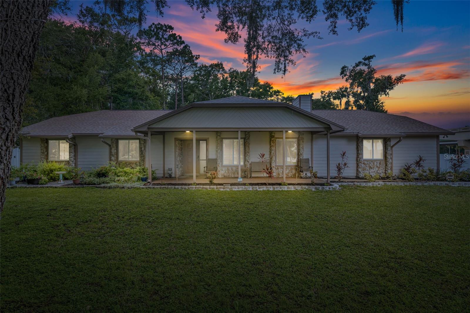 Welcome to 100 Ross Lake Lane, an updated 4-bedroom, 2-bath home on nearly 1.25 acres in a peaceful Sanford setting. Inside, you’ll love the porcelain tile flooring throughout, along with a modern kitchen featuring sparkling quartz countertops and appliances. The tastefully RENOVATED bathrooms provide a clean, spa-like feel, and each bedroom provides plenty of space for family, guests and a home office. Smart upgrades include a new hot water heater, water softening system, NEW SIDING and a 7-year-old roof. Outside is where this home really shines with room for your RVs, boats, and all your big toys. You also have NEW VINYL FENCE around your oversized lot. Whether you’re dreaming of a mini homestead or just want room to roam, this property delivers. No HOA, plenty of privacy, and just a short drive from Downtown Sanford's shopping, dining, and major highways. Don’t miss this rare opportunity to own acreage at an outstanding value!