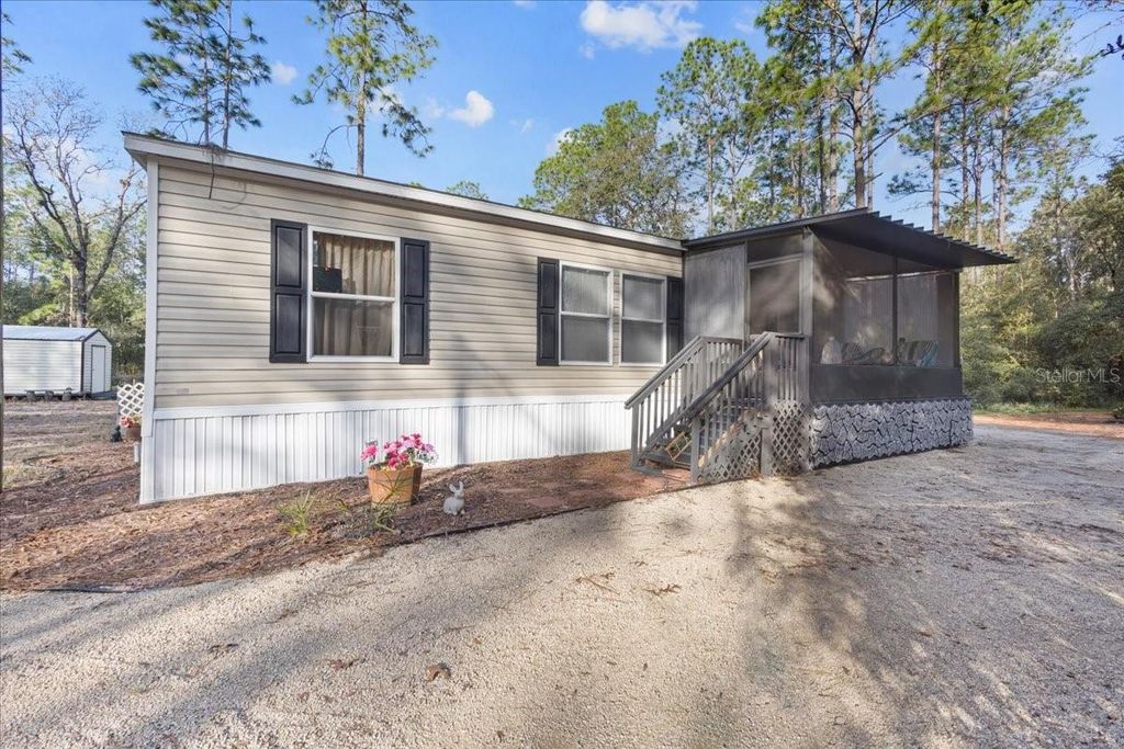 Photo of 5829 NW 11th Avenue, Bell, FL 32619 (MLS # W7882167)