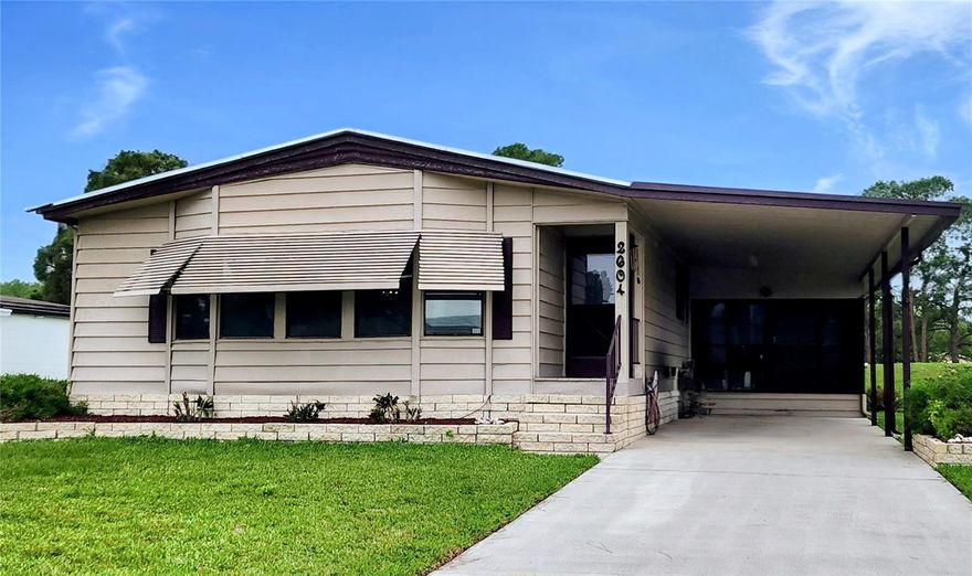 Charming 2-Bedroom, 2-Bath Manufactured Home with Land in a Peaceful Private Community  Well-maintained and move-in ready, this spacious home offers the perfect blend of comfort, convenience, and value. Best of all, you own the land—no lot rent—making this an exceptional opportunity for both homeowners and investors. A recently upgraded electrical panel and meter box add extra peace of mind.  Step inside to discover versatile living spaces, including a bright and inviting Florida room enhanced with solar panels, perfect for relaxing year-round. The home also features an indoor laundry area, a dedicated computer/workstation space, and an attached 10x10 workshop ideal for hobbies, projects, or additional storage.  Outside, the durable brick skirting adds both charm and long-lasting curb appeal, while the quiet, private community offers a serene and welcoming environment.  Sold as-is, this property is perfect as a full-time residence, vacation getaway, or investment opportunity. Don’t miss your chance to make it your own—schedule your showing today!