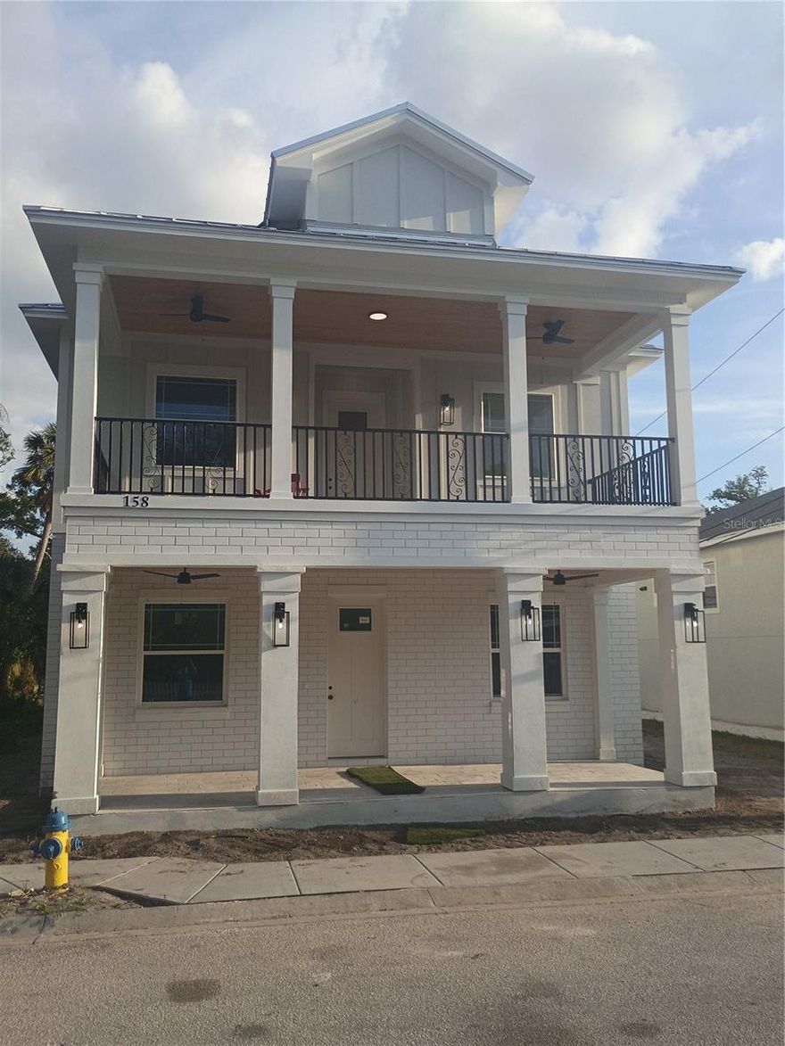 Located in the heart of Tarpon Springs, just minutes from the Tarpon Springs Historic Downtown District, and local Gulf-front Fred Howard Beach, and Sunset Beach, this stunning elevated home blends charm, durability, and modern luxury. Ideally located within walking distance to the Tarpon Springs Sponge Docks, local restaurants, breweries, a distillery, dog park, Pinellas Trail, pickleball courts, a nearby water park, canoe launch, and bayous—this home offers the ultimate Florida lifestyle.

This beautifully constructed 3-bedroom, 2-bathroom residence features an elevated design with a downstairs garage that can be converted into a home gym. office space, plus a bonus room with private elevator access. Built with quality and resilience in mind, the home includes spray foam insulation, a durable metal roof, Miami-Dade high-impact windows, and a 3-point hurricane strapping system for enhanced structural integrity and storm protection. Inside, you’ll find high-end finishes throughout, including custom cabinetry, premium vinyl flooring, custom aluminum railings, and elegant tray (coffered style) ceilings that elevate the living space. Expansive front and rear balconies provide ideal spaces for relaxing or entertaining, with the rear balcony offering direct access to both the living room and the primary suite. The spacious primary suite is a private retreat, featuring a walk-in closet, dual vanities, a walk-in shower, and a freestanding soaking tub. A separate water closet with a stylish barn door adds both function and design appeal.

Additional features include: a double carport and a convenient private rear entrance, enhancing accessibility and everyday ease.