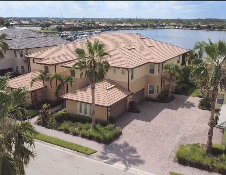 Welcome to Your Waterfront Retreat in Tidewater Preserve
Experience the ultimate Florida lifestyle in this beautifully updated first-floor carriage home, ideally situated within the exclusive, guard-gated community of Tidewater Preserve—a true waterfront sanctuary along the scenic Manatee River. Step inside to an airy, open-concept design with luxury vinyl plank flooring, soaring ceilings, and an entertainer’s dream Cambria quartz island kitchen. The kitchen space features solid wood cabinetry, a French door refrigerator, induction slide-in range (installed Dec. 2024), wine fridge, and even a second refrigerator in the garage. A custom, handcrafted backsplash captures the graceful movement of coastal waves, perfectly complementing the home’s light and breezy nautical theme. This flexible 3-bedroom plan includes a spacious primary suite with a double-sink quartz vanity, custom built-in closet system, and king-sized platform bed. The split-bedroom layout offers guests privacy in the sun-filled second bedroom, while the third bedroom is ideal for a home office or den. Relax on your private lanai overlooking the tranquil lagoon—perfect for sunrise coffee or a sunset wind-down. Offered fully furnished (optional), this move-in ready home allows you to start enjoying the resort lifestyle right away.
Community Highlights:
-Marina with boat slips and lifts, offering direct Gulf access
-Three sparkling pools, including a beach-entry main pool
-Two state-of-the-art fitness centers
-Tennis courts, kayak launch, and scenic nature trail
-Pet-friendly spaces including a dog park
-Year-round social events from boat parades to live music
-All lawn care and landscaping are handled by the HOA, leaving you free to explore Anna Maria Island, Siesta Key, St. Pete, and Sarasota—or simply cruise to local waterfront dining.
Additional Peace of Mind:
No current HOA assessments or lawsuits, and the building is not subject to Florida’s Milestone Inspection requirements (under three stories).
This rare Tidewater Preserve offering combines location, luxury, and value in one move-in ready package. Schedule your private showing today—this gem won’t last!