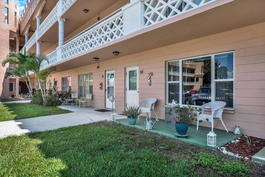 GROUND FLOOR living in On Top of the World means no stairs, no elevator waits, no carpet in sight, and two personal patios to step out onto whenever the Florida air calls. This 1-bedroom, 1-bath condo with a step in shower, is in one of Clearwater's most beloved 55+ communities. It offers the NEWER 2016 windows/door, 825 square feet of comfortable, easy-care living with a community built around actually enjoying your days.
Inside, a pass-through from the kitchen to the dining area keeps things open and connected, easy for morning coffee or tea, easy for hosting a neighbor for lunch. Enjoy your rare personal COVERED back patio AND your front patio and you'll understand why so many residents here never want to leave. This unit is IDEALLY LOCATED on a cul-de-sac and your assigned parking spot sits right out front, making bringing groceries hassle free. The building laundry is conveniently steps away. The main activity (east) center is so close it’s practically outside your door! 
Amenities is where On Top of the World earns its name: two heated pools, a hot tub, sauna, and a fully equipped cardio fitness center. Two private golf courses, an 18-hole and a 9-hole, are free exclusively for resident owners. Tennis courts, pickleball courts, shuffleboard courts, lawn bowling courts, a nature's gym, and a pavilion park round out the outdoor options. The fenced dog park has covered seating. Hobby studios, a wood shop, a billiards room, and the on-site Good Karma Café, keep daily life convenient and social. TWO activity centers host a full calendar year-round,  more than 175 clubs to choose from, tribute band performances, bingo, farmers markets, food truck days, fitness classes, dancing, theater, and more. There's always something happening! Scheduled community transportation picks up right at your building and runs regularly to Publix, Walmart, Countryside Mall, Clearwater Mall, and beyond.
This property is being transferred by a leasehold estate deed. Association approval is required. Monthly fees cover internet, cable, and water. If financing, 35% down is required.
Many beaches are close! The lifestyle is here! Schedule your showing!