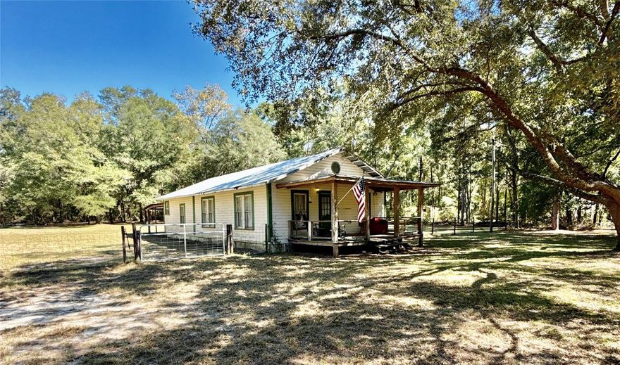 One or more photo(s) has been virtually staged. Welcome to your peaceful retreat in beautiful North Florida! This charming 3-bedroom, 2-bath home sits on two parcels totaling 3.04 acres of serene country living. Originally the Fort White Public Library, the structure was later moved to its current location and thoughtfully expanded, blending unique local history with comfortable modern living.

Enjoy your morning coffee on the inviting front porch, surrounded by nature, open space, and abundant possibilities. The expansive acreage offers plenty of room for gardening, outdoor activities, hobby projects, or future improvements.

Conveniently located near several of North Florida’s renowned freshwater springs—including Ichetucknee, Ginnie, and Poe Springs—you’ll have quick access to some of the area’s best swimming, tubing, and kayaking. The property is also just a short drive to Gainesville, home to the University of Florida and UF Health Shands Hospital, providing world-class education, healthcare, dining, and amenities while still allowing you to enjoy the quiet, rural lifestyle.

This property truly offers the best of both worlds—historic charm, peaceful country living, and easy access to everything North Florida has to offer.
