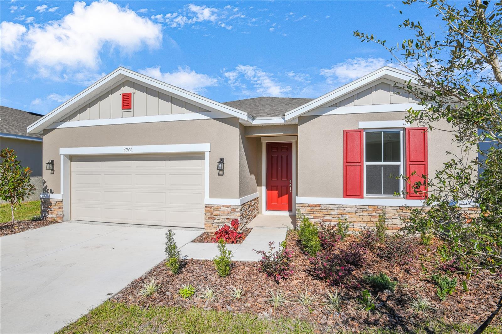 Welcome to this stunning Slate home, ready for quick move-in! Included features: a charming covered entry; an open great room with center-meet doors leading onto a covered patio; a nook that flows into a well-appointed kitchen boasting white 42" cabinets, a large island and stainless-steel appliances; a convenient laundry; an elegant primary suite showcasing a roomy walk-in closet and a private bath with a separate shower and soaking tub; three additional bedrooms, including one with an attached bath; and a third full bath. This home also has quartz countertops. Tour today!