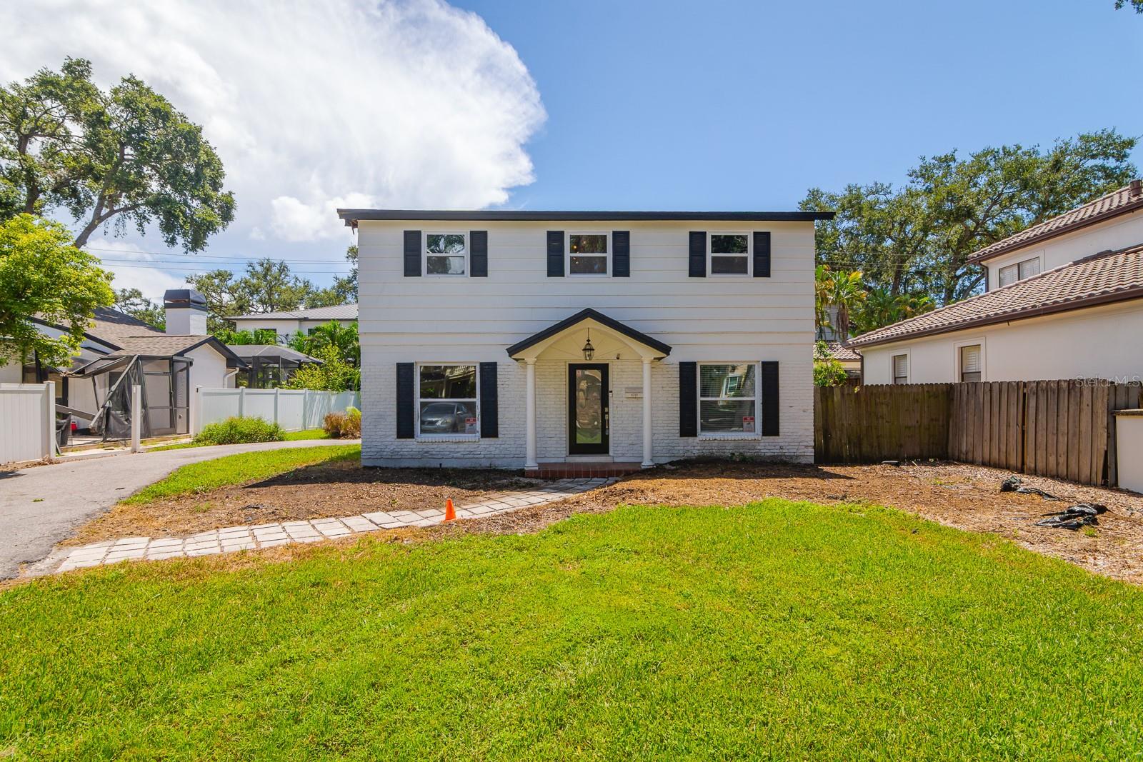Opportunity awaits in the heart of highly sought-after Beach Park! This traditional two-story home sits on a .18-acre lot with room for a pool, tucked away on one of South Tampa’s most iconic, tree-lined streets. Offering 3 bedrooms and 2 baths across 1,761 sq. ft., the home was built in 1963 and is ready for a complete renovation. The property has already been remediated, with most drywall, flooring, and appliances removed—making it the perfect blank canvas to reimagine. The home did not flood during Hurricane Milton; damage occurred when grand oak trees came down on the property. Those trees have since been removed, increasing the developable area of the lot by approximately 25% and creating greater flexibility for future expansion and design. Current setbacks for building on the lot are 25 feet in the front, 7 feet on the sides, and 20 feet in the backyard. The seller also has engineer-stamped plans available that showcase an incredible vision for the home, including a new 2-car garage, a larger kitchen, and an expanded primary suite with a luxurious bathroom. With the trees cleared, now is the ideal time to expand and transform this property into a modern residence that matches its prestigious surroundings. Beach Park is one of South Tampa’s most desirable neighborhoods, known for its mix of luxury and timeless homes, tree-shaded streets, and unbeatable location close to Midtown, Hyde Park, Downtown, Tampa International Airport, and top-rated dining and shopping. Families will also appreciate being zoned for Grady Elementary, Coleman Middle, and Plant High School—an A+ rated district. Don’t miss this rare opportunity to design and build your dream home in one of Tampa’s most established communities.
