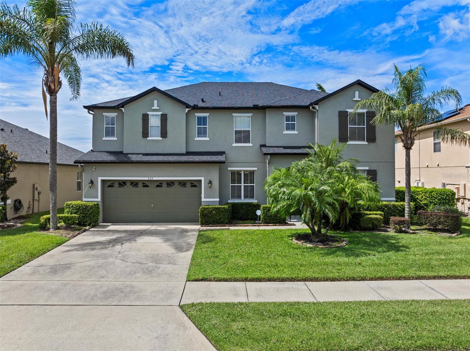 Tired of house hunting and finally ready to be HOME? How does one in Winter Garden and currently rated as an A RATED SCHOOL ZONE sound?! Look no further. Welcome home! This 5-BEDROOM, 3-BATH + BONUS ROOM residence in the GATED Black Lake Park community is ready for you! With a NEW ROOF (2023), FRESH EXTERIOR PAINT (2023), the open-concept main floor you want, plus a flexible layout that truly “has it all.” This two-story plan features no carpet, adds a full bedroom and full bath downstairs, and a bonus room. This home and plan will work great for your lifestyle but also for guests, anyone avoiding stairs, or for when you are entertaining and don't want anyone heading to your more private rooms!
The sellers reimagined the entire first level into a bright, flowing great room anchored by an updated kitchen: Large island, granite countertops, 42" cabinets with LED lighting, stylish backsplash, stainless appliances, and a casual breakfast nook area. Adjacent spaces give you options, as well. A generous dining room and French doors lead into the handy bonus area near the stairs for homework, hobbies, or a quiet reading corner.
Head up the LED-lit staircase to a spacious loft, perfect as a media lounge, playroom, or gym. This spot is also outfitted with recessed LED lighting for a clean, modern look. The primary suite is a true retreat with French doors, a tray ceiling, a customized walk-in closet, and a beautiful bathroom featuring dual vanities and an oversize walk-in shower with two rain shower heads. The other 4 bedrooms are large and each closet has been customized to maximize storage.
Daily life is also easier here: an inside laundry room includes a double-basin wash sink and extra storage. When it’s time to entertain, French doors from the breakfast nook area open out to a screened, paver-finished patio with an additional extended open paver zone that’s perfect for grilling or al-fresco dining. Mature, refreshed landscaping enhances privacy—an uncommon perk in this pocket of Winter Garden. Don’t need to see my rear neighbors? Yes, please!
Black Lake Park adds to the experience, as it delivers the amenities everyone wants: A community pool, tennis and basketball courts, playground, gazebo/park space, sidewalks, and private neighborhood access to Black Lake via a dock/boat-ramp area. Gated entry and a calendar of neighborhood events add to the appeal.
As you may know, the location seals the deal! You are just minutes to Winter Garden Village, historic Downtown Winter Garden, and you have quick connections to the 429 and major commuter routes keeping shopping, dining, healthcare, and your work commutes simple and effective. Schedule your private showing today!