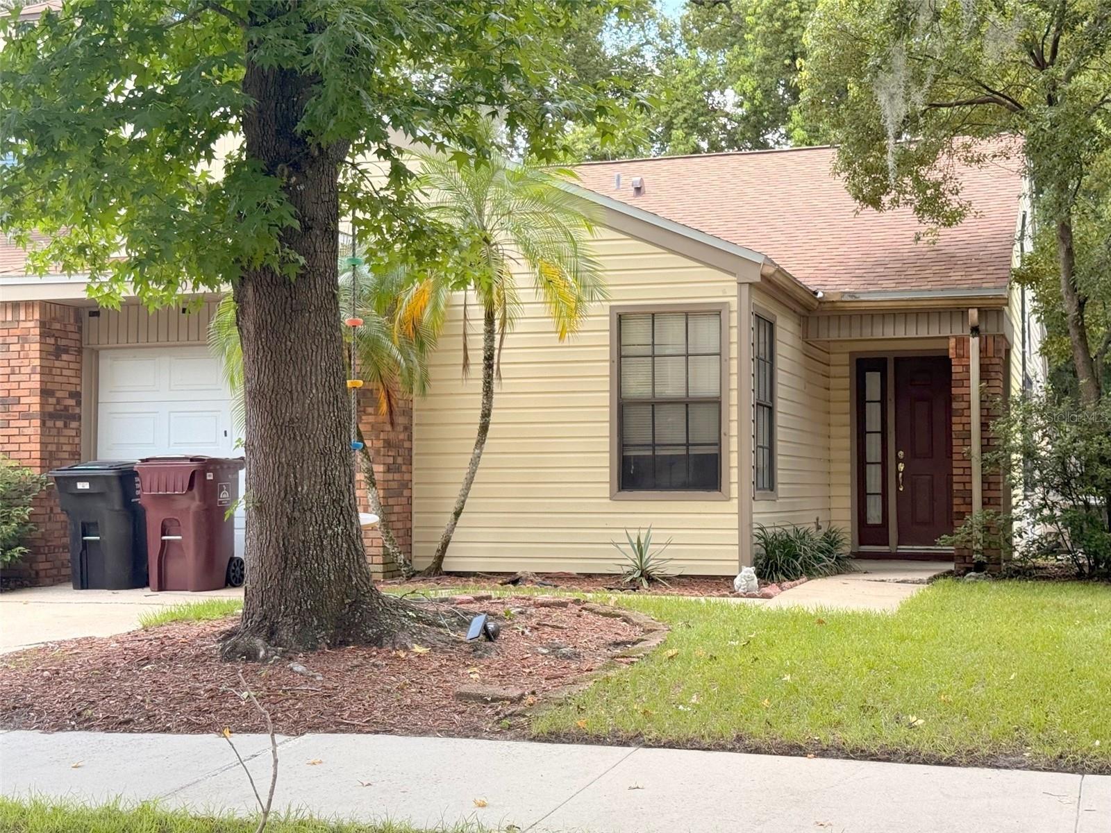 This 2 bedroom, 2 bath duplex is located in the Bryn Mawr subdivision of the Conway area. Lots of windows and skylights let in the natural light to the open, split floor plan which features cathedral ceilings, laminate flooring, sliding doors from the living room and master bedroom and a one car attached garage. The partially fenced yard with an open patio has lots of shade trees and offers privacy to enjoy the outdoors. A community pool is available for your use. The interior has been freshly painted. The location can't be beat with easy access to the Orlando Airport and State Road 408. Lots of shopping and restaurants are nearby. Move in ready! LAWN CAR IS INCLUDED IN THE RENT!