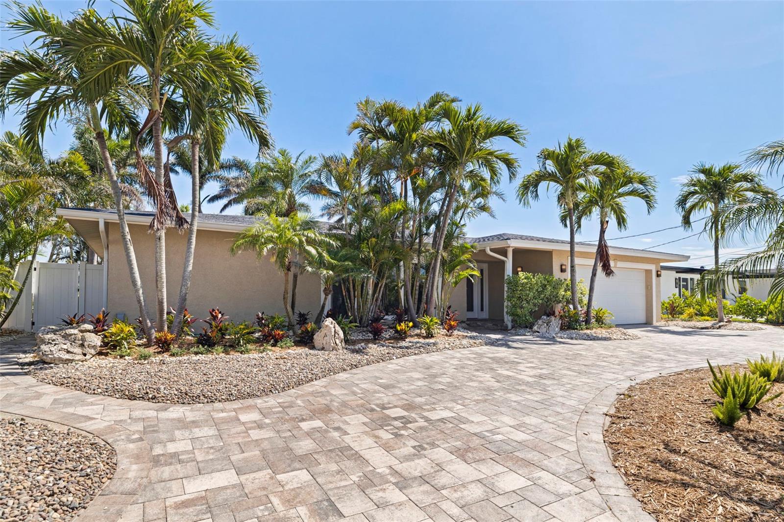 Welcome to your updated oasis in the coveted neighborhood of Belle Vista. This stunning 4-bedroom, 3-bathroom home offers unparalleled views and luxurious amenities, perfect for those seeking both comfort and elegance. Upon entry, you'll be greeted by a spacious, light-filled living area, seamlessly blending modern design with coastal charm. The gourmet kitchen features sleek countertops, premium appliances, and ample storage, ideal for culinary enthusiasts and entertainers alike. Step outside to your private dock, where breathtaking sunsets and tranquil waters await. Whether you enjoy boating, fishing, or simply relaxing by the water's edge, this home provides the ultimate waterfront lifestyle. Retreat to the master suite boasting more than enough space for a king-sized bed and an excellent view of the water. Two additional bedrooms on the split floorplan offer flexibility for guests or a home office, each designed with comfort and style in mind. Located in one of Florida's prime neighborhoods, this home is minutes away from pristine beaches, fine dining, and vibrant nightlife. Embrace the coastal lifestyle with easy access to cultural attractions and outdoor adventures. Don't miss this rare opportunity to own a piece of paradise in St. Pete Beach. Schedule your private showing today and experience waterfront living at its finest. This home has had been remediated.