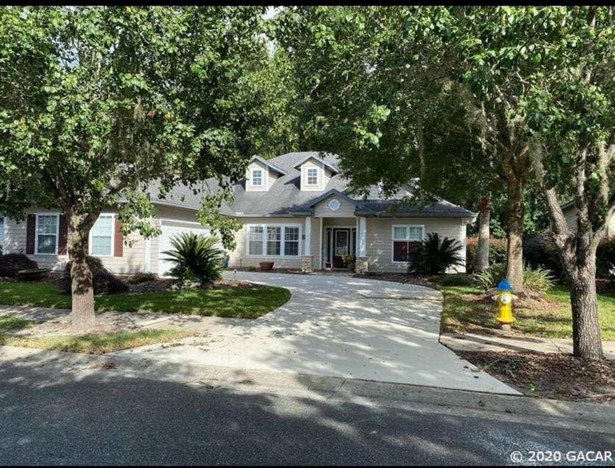 This beautiful spacious home in the highly sought after neighborhood of Longleaf Village features 4 bedrooms and 3 full baths.  Hardwood floors welcome you as you enter the home, a wood burning fireplace is central to the living room that is open to the spacious kitchen.  Hardwood cabinets and a gas stove are featured in the kitchen.  The owners retreat boasts a gas fireplace along with double walk-in closets.  The owner's bathroom has double sinks and a large whirlpool bathtub.  A large screened and pavered lanai offers peace and quiet.  The house backs up to a private wooded preservation area within the neighborhood.  The community boasts a beach entry pool, clubhouse with fitness center, basketball courts and tennis courts as well as a playground.  With easy access to UF campus, hospitals and top-notch dining and shopping, this home is sure to meet all of your needs.  This property will be available for showing beginning January 1, 2024 and for rent January 15, 2024.  Please contact owner/agent before January 1 for inquiries.