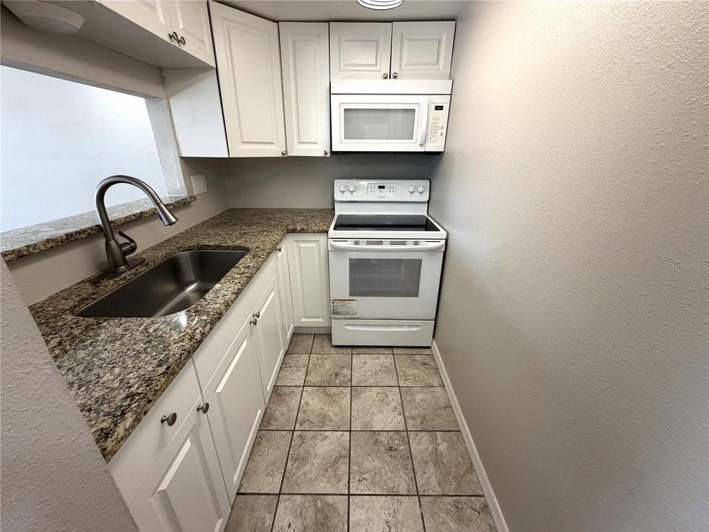 Photo of 7113 E Bank Drive #7113, Tampa, FL 33617 (MLS # O6389838)