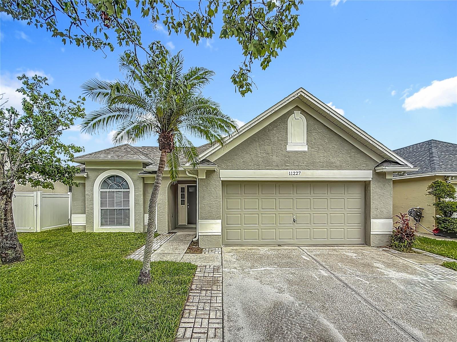 Discover your dream home at 11227 Thicket Ct, Tampa, FL 33624, a beautifully updated one-story single-family residence nestled in the heart of the desirable Plantation community. This charming 3-bedroom, 2-bathroom home spans 1,550 square feet and boasts a modern, open layout perfect for both relaxation and entertaining. The completely renovated kitchen shines with sleek white shaker cabinets, stainless steel appliances, and elegant Corian countertops, complemented by stylish tile flooring. Both bathrooms have been fully updated with contemporary fixtures and finishes, while wood-look laminate flooring flows seamlessly throughout the home, adding warmth and durability. Recent upgrades, including fresh interior and exterior paint, new gutters, and a re-screened rear patio, ensure move-in-ready convenience and low maintenance. Enjoy peace of mind with 2020 Roof, 2020 Water Heater and 2019 AC. The attached 2-car garage provides ample storage and parking. As part of the Plantation Homeowners Inc., residents enjoy access to exceptional amenities, including a clubhouse, two sparkling pools, basketball and racquetball courts, baseball and soccer fields, a playground, and a dog park, all set amidst 55 acres of scenic lakes and 64 acres of recreational spaces. Perfectly located, this home offers easy access to Tampa’s vibrant attractions within a 20-mile radius, such as the thrilling rides at Busch Gardens (10 miles), the cultural exhibits at the Tampa Museum of Art (12 miles), and the serene trails of Lettuce Lake Park (15 miles). Enjoy shopping and dining at Citrus Park Mall (5 miles) or take a short drive to the beautiful beaches of Clearwater (18 miles). With its prime location, modern upgrades, and community perks, 11227 Thicket Ct is the ideal place to call home.