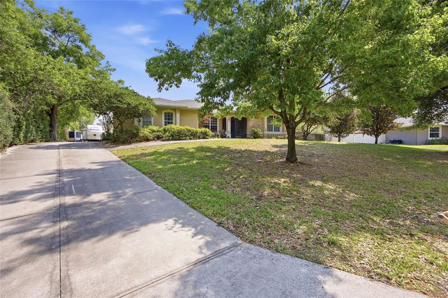 Welcome to a truly one-of-a-kind custom estate located in the highly sought-after Highland Point community on Parkway Drive in Clermont. Situated on an expansive .64-acre homesite, this meticulously maintained 4-bedroom, 4-bathroom residence offers the kind of space, privacy, and character that is becoming harder to find.

Highland Point is a quiet, established neighborhood where homes rarely come available, complete with private lake access exclusively for residents. Perfect for those who value both community and privacy without the crowds.

From the moment you walk in, the home has a completely different feel than your typical Florida property. Rich, real wood cabinetry throughout creates a warm, mountain-style atmosphere that immediately sets it apart. The split floor plan offers both functionality and privacy, with over 3,000 square feet of living space, spacious rooms, natural light, and storage thoughtfully built into nearly every hallway.

Out back, the home truly opens up. A large covered patio and screened pool overlook the oversized lot, creating the perfect setup for relaxing evenings, entertaining, or simply enjoying the quiet surroundings.

For those who need space beyond the home itself, this property delivers in a big way. In addition to the existing 3-car garage, there is an approximately 1,800+ square foot finished two-bay garage connected by a breezeway. Designed without windows for added security, this space is ideal for car enthusiasts, hobbyists, or anyone needing serious room for equipment, projects, or recreational vehicles.

Major updates have already been taken care of, including a new roof, new AC system, and new pool pump. The property also features a private irrigation well, along with access to the community well for household water.

If you’ve been waiting for something with character, space, and functionality, this is not your typical home, and it’s one you’ll want to experience in person.