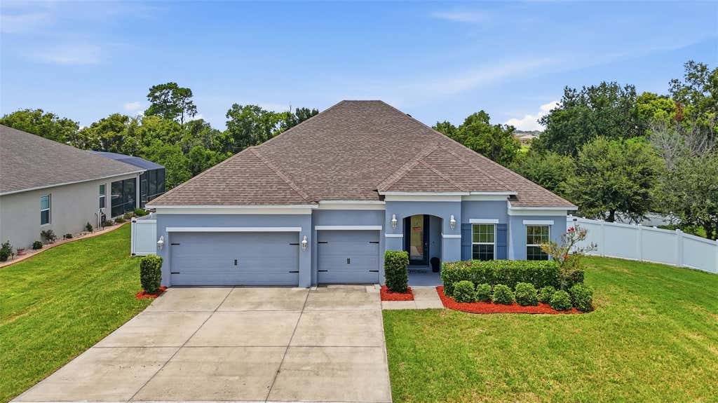 Photo of 1948 Bell Creek Loop, Fruitland Park, FL 34731 (MLS # O6424322)