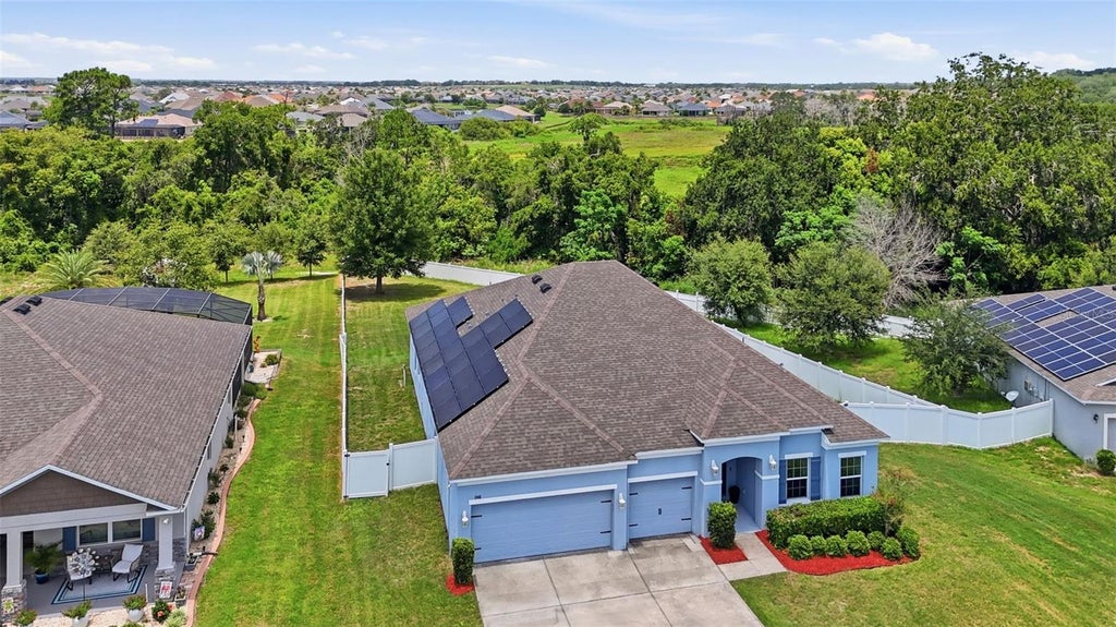 Photo of 1948 Bell Creek Loop, Fruitland Park, FL 34731 (MLS # O6424322)