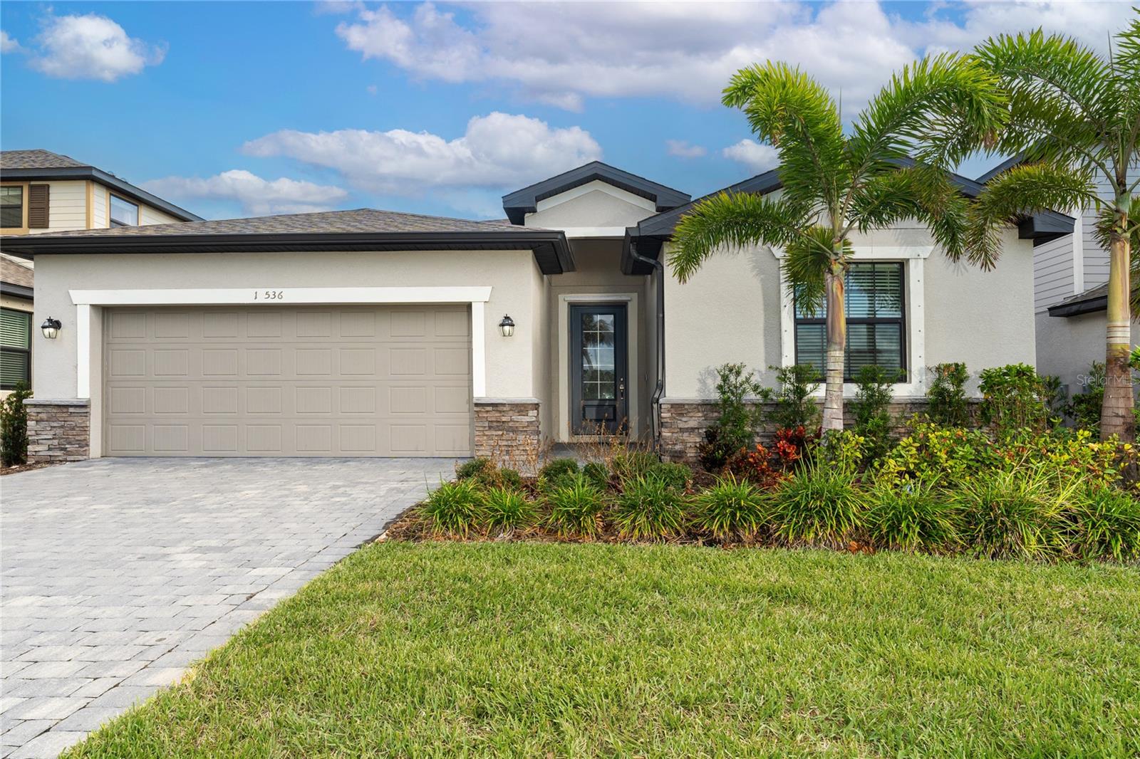 $20,000 PRICE IMPROVEMENT..WOW! Some photos have been staged. This LENNAR BUILT home in 2022 is VACANT, MOVE IN READY, and in the deed restricted community of "TORTUGA", one of WELLEN PARK'S intimate GATED communities! This beautifully Lennar built, SMART home, was completed 5/2022, and is just waiting for you to call it your treasured home! If you don't want to wait for a new home to be built AND experience the possible unexpected construction delays AND multiple price increases in materials and supplies during construction, then this sizeable, open and airy home is ideal for you! This PERFECTLY DESIGNED 2,032 sq. ft., home, features 4 SPACIOUS BEDROOMS and 3 FULL BATHROOMS! The OWNER'S SUITE HAS 2 WALK-IN CLOSETS, stunning large ENSUITE BATHROOM WITH HUGE GLASS ENCLOSED WALK-IN SHOWER, SEPARATE WATER CLOSET, AND LARGE VANITY WITH DUAL SINKS. The chef in your family will just love the KITCHEN, COMPLETE WITH STAINLESS STEEL APPLIANCES, GRANITE COUNTERTOPS, an abundance of WOOD CABINETS, a LARGE PANTRY, and BREAKFAST BAR, which overlooks the spacious family room. The OVERSIZED FAMILY ROOM has endless possibilities for decorating, and its open floor plan includes the dining and eat-in area. BEDROOM 2 ALSO HAS AN ENSUITE BATHROOM WITH A TUB & SHOWER. This SMART home has a RING Video doorbell system, brick paver driveway, entryway and lanai. The community of Tortuga has an area park and playground for its residents to use, which is just a short distance from this home. The HOA Fee includes a maintenance free, gated community, lawn mowing, edging, fertilization, water for irrigation, cable TV and internet! The community of Tortuga, made up of single-family residences, is WITHIN MINUTES OF THE NEW WELLEN PARK and all the fabulous amenities it has to offer, AS WELL AS THE NEW COSTCO! All that Venice has to offer and all that you could possibly want in the form of shopping, entertainment, dining, beaches, fishing, golf, the interstate, CoolToday Park: which is the spring training home of the Atlanta Braves of Major League Baseball, and more, is just a short driving distance away! How could you want to live anywhere else? Schedule your showing today of this SPACIOUS, BEAUTIFULLY BUILT AND MOVE-IN READY home!