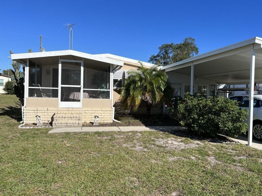 MORE PHOTOS COMING!! Beautifully maintained and upgraded 2 bedroom, 2 bathroom home in rural lake front 55+ manufactured home community. The home is completely and nicely furnished, and ready to move into. This community is located on the largest lake in Polk County and is known for trophy Bass.  A huge Florida room is great for enjoying your morning coffee, or entertaining. If you're looking for a peaceful, serene setting, this is it. Enjoy the peace and quiet of rural living but still close to everything.  Orlando attractions are an hour away.  Beaches on both coasts are an hour and a half drive.  Make your appointment for a private showing.
