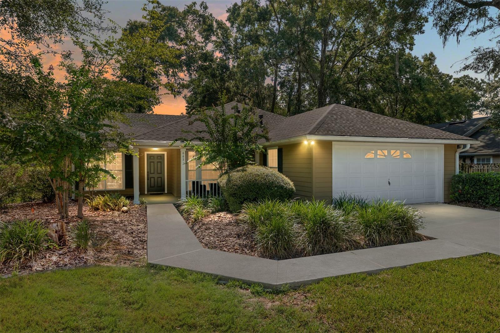 One or more photo(s) has been virtually staged. ***SELLER IS PROVIDING A $5000 CREDIT & 1 YR HOME WARRANTY AT CLOSING***. Welcome to this charming 3-bedroom, 2-bath home in the highly desirable Mentone community. Step inside to an inviting open floor plan with a split-bedroom layout, luxury vinyl flooring throughout, and no carpet anywhere. The kitchen features newer stainless steel appliances, epoxy counters for a fresh, modern touch, along with a breakfast nook in addition to the formal dining room—perfect for casual mornings or hosting friends and family. Built-in bookshelves add character, while new light fixtures give the home a bright, updated feel. The indoor laundry room makes everyday living convenient, and the home is hardwired for ethernet, making remote work or streaming a breeze. Outside, you’ll love the brand-new driveway and sidewalk, a fully fenced backyard, and multiple spaces for relaxing or entertaining—a covered lanai plus an open paver patio with seating and a fire pit. Recent updates include a 2021 roof, 2023 range and dishwasher and 2022 washer and dryer. HOA fees are just $208/quarter, giving you access to neighborhood amenities like a heated pool, kiddie pool, pavilion, pickleball on the tennis courts, basketball court, playground, and walking trails. All of this is just minutes from UF, Shands, Celebration Pointe, Butler Plaza, and more—and the home is on Clay Electric for lower utility costs.