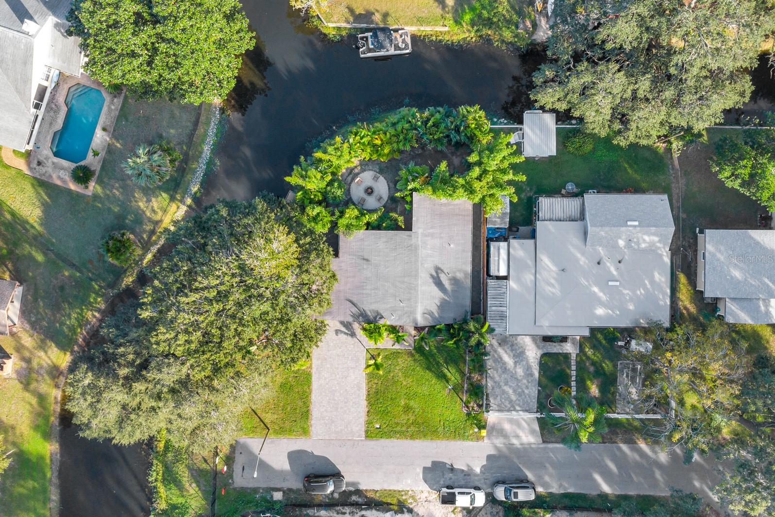 If you’ve been searching for the perfect waterfront property to enjoy now—or build your dream lakefront home later—this is your opportunity! Nestled on a quiet dead-end street, this rare gem offers the best of both worlds: peaceful canal-front privacy (over half the property) with over a mile of open water views from the front of the property. It's TRULY a lake lover’s dream come true.
The existing mid-century modern home is move-in ready and packed with updates, including all-new LVP flooring throughout, updated lighting and a completely renovated kitchen featuring modern cabinetry, quartz countertops, and brand new stainless appliances. Major systems have also been upgraded with a newer roof, A/C, and hot water heater.
The oversized garage opens to a covered outdoor entertaining space, complete with a summer kitchen—perfect for cookouts and sunset hangouts. Step outside to a new composite floating dock and deck, thoughtfully lit and anchored by a cozy fire pit area where wildlife like otters, ducks, and even eagles often stop by!
Additional features include a teak outdoor shower, organic garden beds, a paved driveway, Ring security system, and an irrigation system sourced from a natural spring.
Whether you're ready to enjoy lakefront living now or looking build the custom home of your dreams here, this property combines tranquility, nature, and endless potential. Don’t miss your chance to own this slice of Lake Conway paradise—schedule your private showing today!