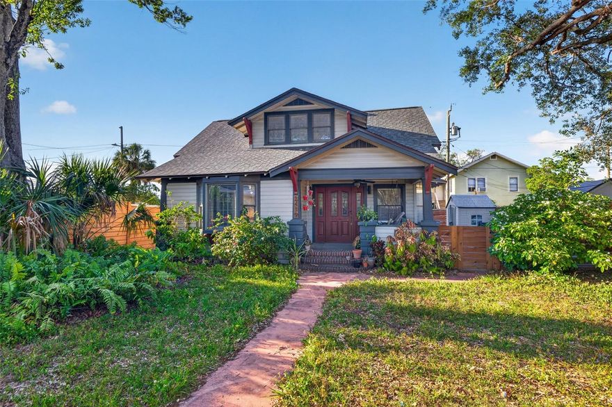 This home is situated on a special lot nestled in the highly sought after neighborhood of Historic Kenwood.
When you enter through the updated front gate and pergola you are immediately greeted by an expansive front yard.  A perfect way to show off your spectacular garden as your guests walk literally fifty feet to the front door.  The home has a beautiful front porch where you can enjoy morning coffee swinging on your porch swing.  When you enter the home you are greeted by a lovely living room with hardwood floors, original details and a fireplace.  Beyond the living space is a sizable eat in kitchen with updated appliances and granite countertops.  Off the kitchen to the west of the home is your separate laundry and a full bath with plenty of storage.  From the kitchen you can also access the outdoors for Alfresco dining.  On the first floor is also the primary bedroom with a delightful en suite.  Plenty of natural light and privacy from the rest of the house.  On the second floor are two adorable bedrooms.  One with a desk nook and a walk in closet.  Perfect for a growing family and/or a work from home situation.  This home boasts two car parking, hardwood floors and original details throughout.  Definitely a charmer and wont last long!