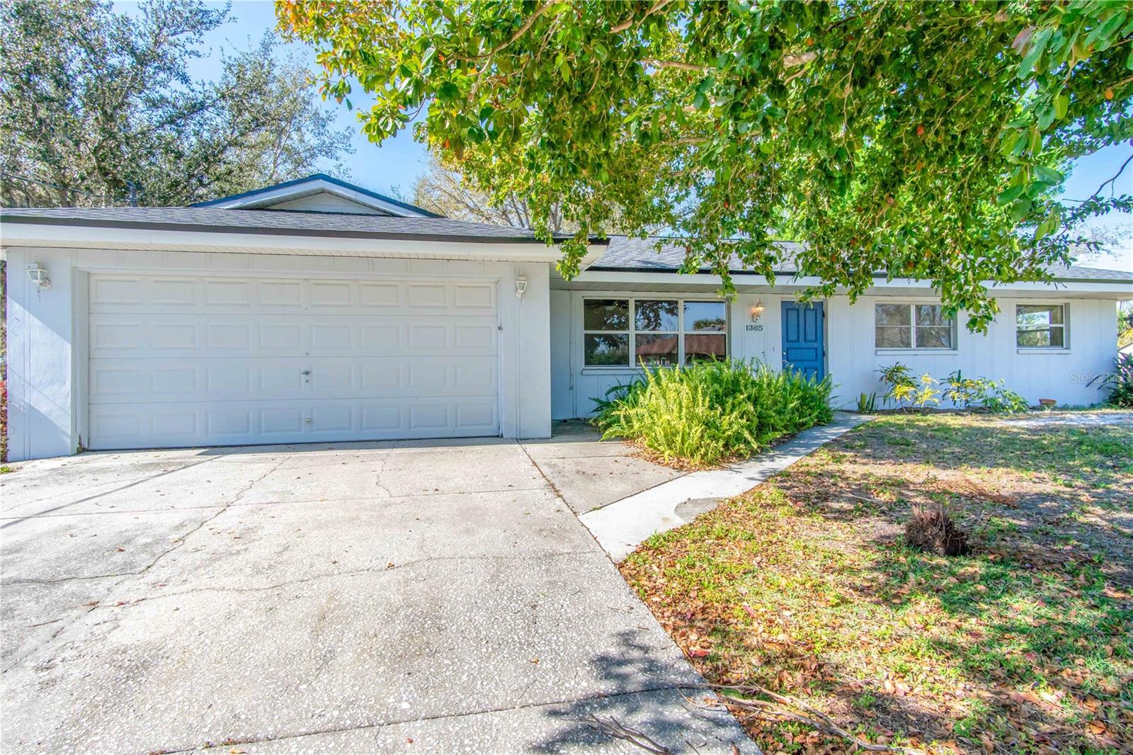 DOUBLE WATERFRONT LOT HOME! This is a diamond in the rough with tons of potential! Let's begin with the most important features... *2023 - New roof, soffit, and fascia *2022 - New electric panel *2020 - New septic tank and drainfield *2019 - water heater *Updated garage door *Double waterfront lot with seawall *Not in a flood zone *No deed restrictions or HOA *Detached 22x30 garage *4x6 Screened garden enclosure *Fenced chicken coop area *Backyard shed *10x17 Wood deck overlooking the water with concrete stairs leading down. This is a three bedroom home with an additional flex room/office area. The office has an exterior door opening to the side fenced-in yard, in addition to the french doors opening into the large 22x14 family room. This family room is bright and beautiful with wood tongue and groove ceilings and accent walls, traditional Mexican floor tile, and a decorative gas fireplace. The kitchen offers the perfect pallet for making this home your own with serene waterfront backyard views. The double door laundry closet currently houses the washer and dryer (which are included), plus there is extra storage space to be creative with. All three bedrooms are located on the same side of the house. The two guest rooms share the hallway bathroom which has a tub/shower combo. The master bedroom has its own bathroom with a walk-in shower plus an exterior door leading out to the large 14x14 screen enclosed lanai with glass windows making it a great place to relax all year long! With some TLC, the backyard will be amazing with all of the plants & gorgeous mature trees. With almost 1/2 an acre of land (including the additional waterfront lot), your canvas is even larger for bigger and better things!
