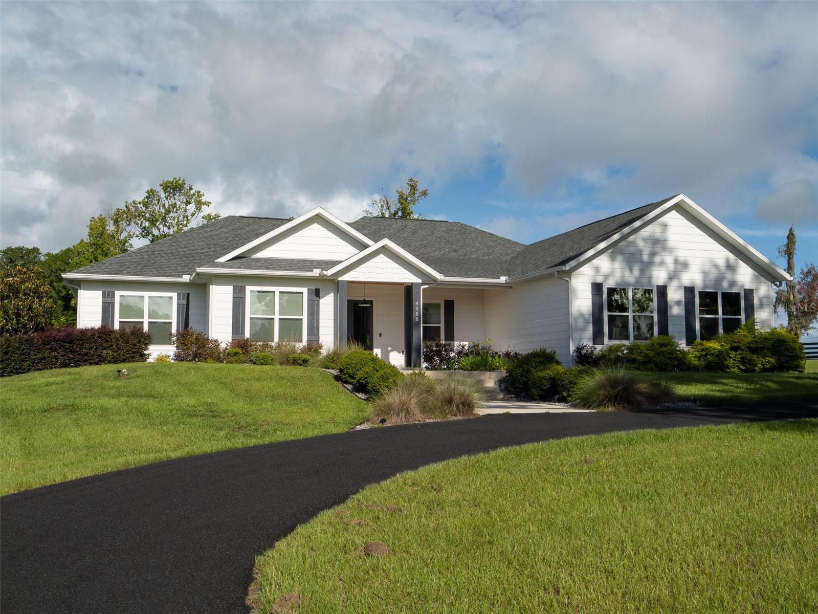 Welcome to this mini horse farm located in the desirable gated community of Equestrian Springs in Northwest Ocala! Covering 4.16 meticulously maintained acres, this property perfectly blends modern comfort and equestrian convenience. The residence, a contemporary build from 2020, features 4 spacious bedrooms and 2.5 bathrooms, providing ample space for family and guests. Designed with an open floor plan, the home boasts a bright and fresh interior, complemented by a well-appointed kitchen that’s perfect for everyday living. Large windows and a thoughtful layout create a welcoming atmosphere filled with natural light. Equestrian lovers will appreciate the newly renovated 3-Saratoga stall barn. The gated community offers access to nearby horse trail riding, allowing you to explore the scenic surroundings at your leisure. After a day of riding, relax by your private pool, an ideal spot for unwinding and enjoying the serene environment. Conveniently located just 15 minutes from the renowned World Equestrian Center, this property offers easy access to world-class equestrian events, facilities, and amenities. Whether you are a competitive rider or simply love the equestrian lifestyle, this location provides everything you need. This horse farm is more than just a home; it's a lifestyle. Experience the perfect balance of luxury, convenience, and tranquility in a community designed for those who cherish the equestrian way of life. Don’t miss this rare opportunity to own a piece of Ocala’s finest countryside.