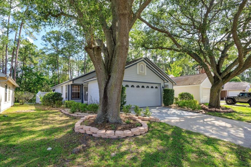 Tucked among oak trees and backing to a canal with no rear neighbors, this 3 bed/ 2 bath/ 2 car garage home is ready for it’s new owners! Well cared for and featuring a newer roof (2024) and AC (6 yrs old). This home was completely re-built and remodeled in 2006 to include a larger primary bathroom, vaulted ceilings and a better overall floor plan. Tile and laminate wood flooring in main areas and one bedroom with carpet in the primary bedroom and one guest bedroom. The patio is screened and the yard is fully fenced- privacy fence along the sides and picket fence along the back to enhance the view. Homeowners have access to all the Hidden Lakes amenities for a low annual HOA fee- one block from the home is a community pool, tennis/pickleball courts, fishing pier and lake access. A short drive takes you to Lee P. Moore Park with baseball field, basketball court, racquetball courts, tennis courts, playground, workout areas and picnic pavilions. This community is close to shopping, restaurants, schools and major roadways allowing for easy access to all that Central Florida has to offer (417, I-4, 429).