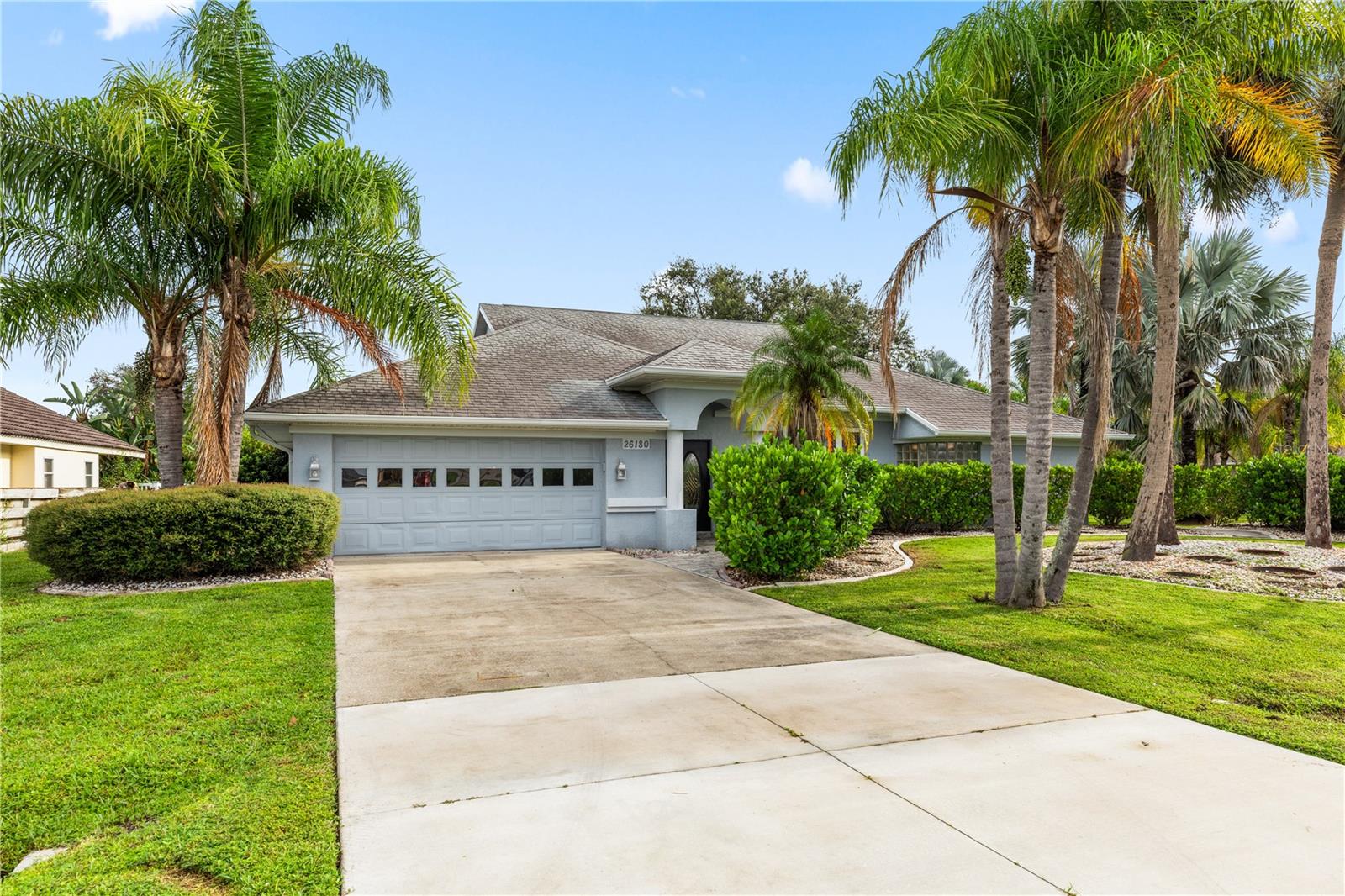 Welcome to this BEAUTIFUL 3-bedroom, 2-bathroom, 2-car garage, pool home located in the desirable Deep Creek community of Punta Gorda. CLICK ON THE VIRTUAL TOUR LINK 1 FOR THE VIDEO AND VIRTUAL LINK 2 FOR THE 3D TOUR. The French door entry opens to a welcoming foyer and a bright floor plan with high vaulted ceilings, and plenty of natural light, creating a spacious and airy feel. The living and dining room flow seamlessly to the kitchen, perfect for entertaining. The eat-in kitchen features granite countertops, stainless steel appliances, including a double oven, a built-in desk, and an abundance of cabinet and counter space. Just off the kitchen, the family room provides additional living space to relax or host guests. The expansive master suite is a true retreat with French doors leading to the lanai, a walk-in closet, and a spa-like private bathroom offering a dual sink vanity with makeup space, a jetted jacuzzi tub, and a walk-in shower with dual shower heads. Guest bedrooms are on a split floor plan, providing plenty of privacy, each with walk-in closets and easy access to the shared guest bath, complete with a dual sink vanity, walk-in shower, and convenient pool access. Step outside to your private oasis featuring a spacious screened lanai, heated pool and spa, outdoor shower, and plenty of room for lounging or entertaining. Surrounded by lush landscaping, this backyard is designed for both privacy and relaxation. Deep Creek is a deed-restricted neighborhood with amenities including Deep Creek Social Club, Deep Creek Park, featuring a playground, tennis courts, basketball courts, and Deep Creek Golf Course, just a couple of miles down the road —perfect for staying active or spending time outdoors. Easy access to local favorites such as Fishermen's Village, Ponce De Leon Park, shopping & boutiques, fine & casual dining, LIVE entertainment, and a short drive to local beaches.*Adjacent lot is available for purchase, Taxes reflect both properties, will be split and reassessed after closing*