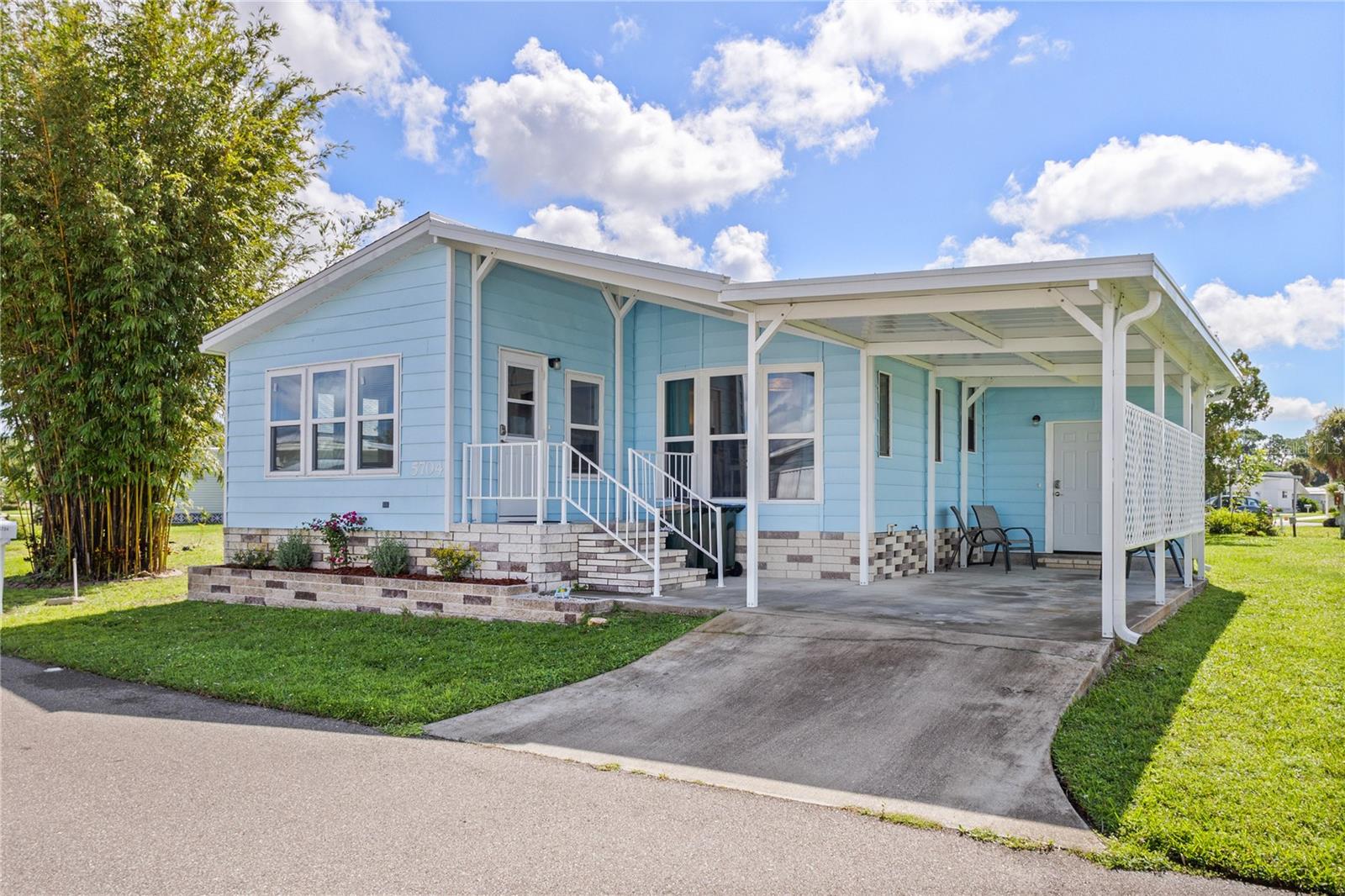 Snowbirds Alert!!! Motivated Seller!!! As you enter this mobile home through the inviting Florida room, you'll be greeted by an abundance of natural light that fills the living room, creating a warm and welcoming atmosphere. Adjacent to the living area, the cozy kitchen nook leads into a well-appointed kitchen, ideal for entertaining or quiet evenings at home. Just outside the kitchen, you'll find a convenient extra storage room, which houses the washer and dryer.
<bt>
<br>
The layout includes a comfortable guest bedroom and bathroom, as well as a generous primary bedroom with an en-suite bathroom for your privacy and convenience. This home is sold FULLY FURNISHED, TURNKEY, making your transition seamless (excludes living room TV and some personal items / can be sold without furniture if desired), move in ready!
<br>
<br>
Recent upgrades ensure peace of mind: a brand-new roof (2023), new carport (2023), almost all new windows (2023 & 2024), and modern appliances including a new fridge, stove, washer, and dryer (all 2022), new dishwasher (2024). The exterior has been freshly painted, new doors have been installed, and a new 40-gallon hot water heater is ready for your use in 2024. A new tiled shower in the primary bathroom is installed in April 2025. The home also features durable aluminum siding for low maintenance. New vaper barrier was installed underneath the house for better protection and insulation.
Holiday Park offers an active lifestyle with two pools, pickleball, shuffleboard, bocce courts, a dart room, horseshoe pits, and ping pong. The fitness center is perfect for keeping fit while enjoying community activities.
<br>
<br>Located within walking distance of local restaurants and shopping, you’ll also be just a short 25-minute drive to the beautiful shores of Manasota or Venice Beach, where you can enjoy breathtaking sunsets over the Gulf of Mexico.
<br>
<br>
In Holiday Park, you own the land with a deed, and the annual association fee of $2,340 is conveniently included in your taxes.
Don’t miss this opportunity to own a piece of paradise in a thriving community—schedule your private showing today!