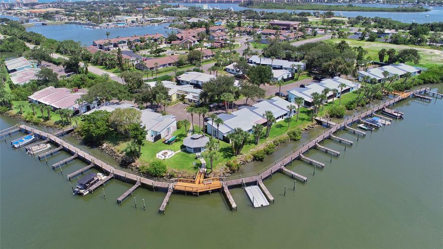 Dolphin Cove's Largest model 2/2. It's just a short boat ride to the intracoastal and Ponce Inlet. Beautiful paddle boarding and kayaking on the backwaters behind Quay Assisi near Marine Discovery Center. It looks like a model and is being SOLD fully well-furnished, as shown. Marble countertops throughout and stainless appliances in the kitchen, but the best part is the decor. Care and attention were used to make the unit "special" and comfortable. It has a strong rental history and has future bookings, which could help pay for itself. Investors, you can use it in the winter and rent monthly the rest of the year. Some weekenders love having their boat in the water and just adore their second home away from home. This Waterfront community has a fishing area, gazebo for group outdoor gatherings, and privately owned boat slips on the boardwalk on the river. Being so near to downtown historic district, allows for a brief walk to the farmers market, restaurants, and/or golf cart ride to cafes and coffee shops. Only 1 mile over the North bridge down Flagler Ave to the beach. For $20,000 may purchase a deeded boat slip, 6 slips to choose from near the unit. ;LocationDescription: Condo ;Water: City