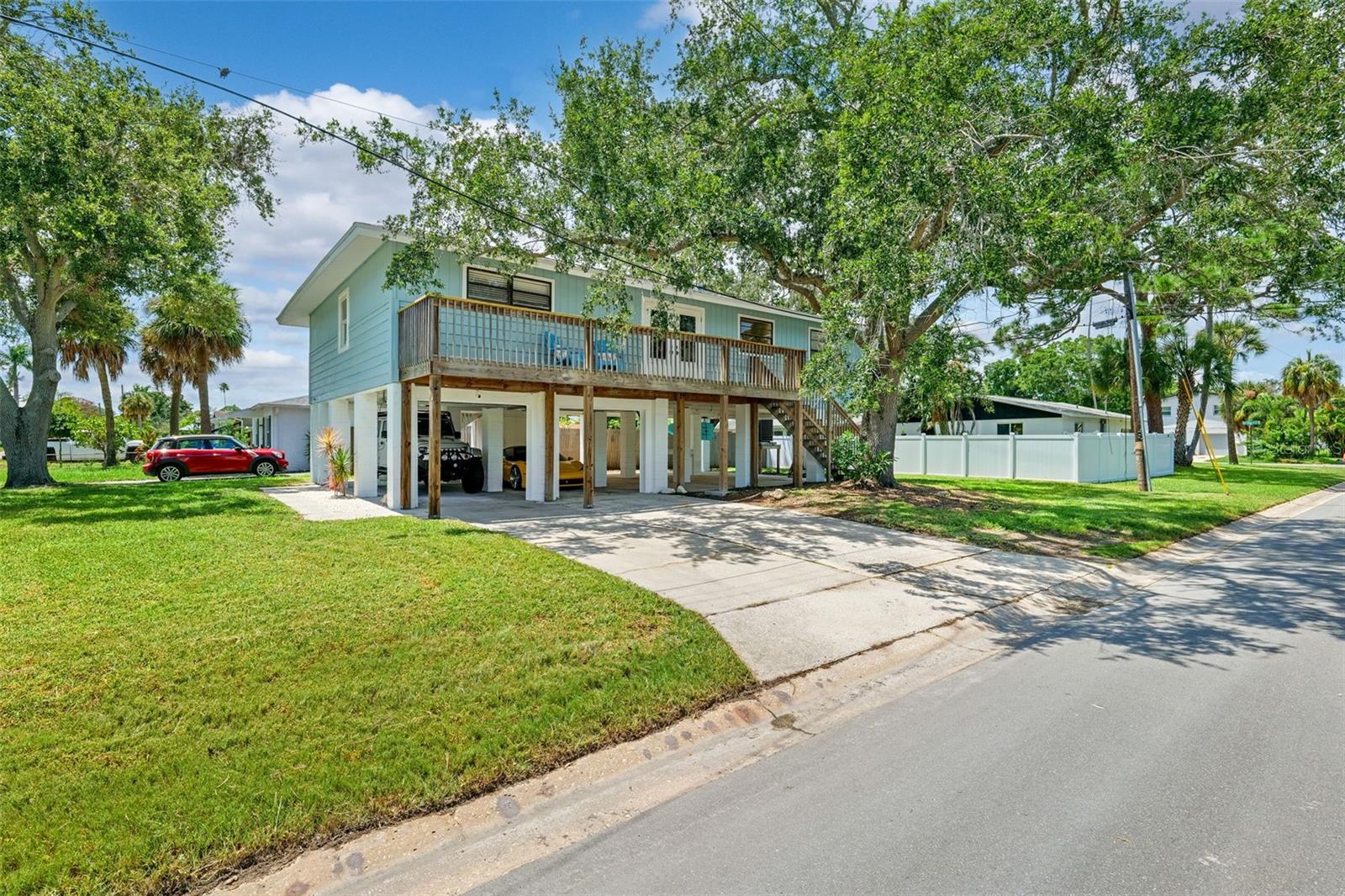 Live Above It All in the Heart of St. Pete! Welcome to your treetop sanctuary in one of St. Pete’s most beloved neighborhoods — where laid-back coastal vibes meet modern, elevated living. Step inside and feel the sunshine pour into this bright, open space that feels more like a modern retreat than your typical home.
You’ll love the smart, split-bedroom layout that offers true privacy — perfect for working from home, hosting guests, or just spreading out in style. The massive primary suite is a dream, with a closet so spacious it's bigger than some bedrooms!
The bathrooms bring the wow factor with imported Italian ceramic tile, giving you spa-day vibes every day. And the kitchen? It’s a clever masterpiece — fully reimagined with hidden drawers, secret compartments, and space-maximizing features you didn’t even know you needed (but now can’t live without).
Every inch of this home reflects thoughtful design and quality craftsmanship, with a new roof (2020) and sleek custom windows and doors (2023) that bring in all the natural light while keeping things ultra energy-efficient. New paint inside and out and dreamy, yet durable flooring. Every element was chosen with care, from the solid-core six-panel interior doors to the bathroom faucet enhanced with a discreet pull-out sprayer. The clean, modern lines throughout create a peaceful, stylish haven that’s as relaxing as it is functional.
And because life in St. Pete is all about the outdoors, you’ll love the generous space below the home — perfect for stashing your kayaks, paddleboards, beach cruisers, and all your coastal adventure gear. Take advantage of everything this neighborhood has to offer including the new rec center and pool, new pickleball courts in Denver Park and countless festivities, block parties and golf cart parades. Minutes from Downtown St Pete, Whole Foods, Trader Joes and the Gandy Bridge. Come experience the perfect blend of style, comfort, function and fun — your St. Pete dream home awaits!