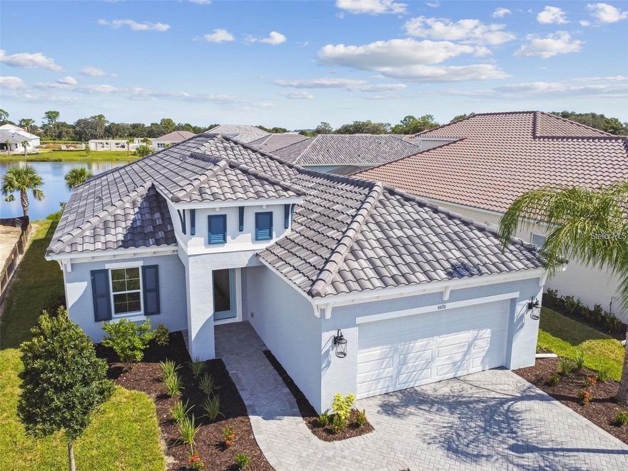 NEWER CONSTRUCTION WITH A PRIVATE POOL AND WATER VIEW! Enjoy Florida living at it's best in this White Star model built in 2022 in the highly desirable, resort-style Neal Community of Grand Park! As you enter your new oasis, you’ll be greeted with the bright and airy open floor plan and sliders that open out to the pool area with a relaxing lake view. The master suite features a tray ceiling, walk in shower, his and her separate closets, and a beautiful water view to wake up to. With 3 bedrooms, 2 1/2 bathrooms, and a den that can easily be used as a 4th bedroom, there is plenty of room for the family. The screened in pool area boasts a large covered space for grilling and entertaining. The Grand Park amenity center offers resort style living which includes two pools, fitness center, pickleball courts, tennis courts, manicured trails for walking/running, playground, dog park, and more! And on top of it all, this is in one of the best school districts! Annual lease. First month, security, and last month to move in. Lawn and pool maintenance included. Tenant is responsible for utilities. Credit check and HOA application required. (Included, but not pictured here - window treatments, ceiling fans/light fixtures in all rooms, washer/dryer, and refrigerator.)