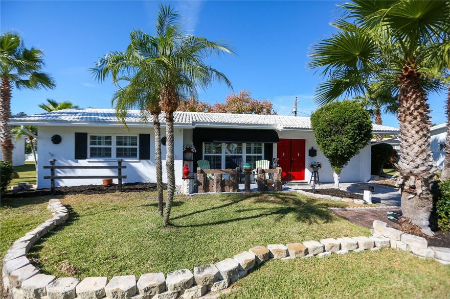 **Welcome to Tamarac By The Gulf — a beautifully maintained 55+ community just minutes from Florida’s world-famous Gulf Beaches.** This well-cared-for **2-bedroom, 2-bath home** also offers a valuable **flex space** that can serve as a 3rd bedroom, office, or hobby room.

As you enter, you’re greeted by a bright and open **living room and dining room combination**, perfect for everyday living and entertaining. Just off the living room is the second bedroom and a full hallway bath. Down the hall, the **spacious primary bedroom** features its own **en-suite bath** for added privacy and comfort.

The kitchen—equipped with a **new dishwasher and microwave**—offers a convenient breakfast bar and sits directly across from the dining room for easy serving. The kitchen overlooks the **family room**, which flows into the flexible bonus space ideal for a 3rd bedroom or home office. From the kitchen, access your **one-car garage**, where the washer and dryer are located.

Step into the **lanai**, then out to the **back patio**, the perfect spot to fire up the grill and enjoy Florida living at its best. A charming **front porch** welcomes you with the perfect place to enjoy your morning coffee while watching the sunrise.

Interior updates include **engineered hardwood flooring** throughout the living room, dining room, kitchen, lanai, and flex space, with **ceramic tile in both bedrooms**. Additional highlights include **plantation shutters, hurricane-rated windows, and ceiling fans throughout**.

The heirs have never lived in the property and completed a **4-point inspection**—report available upon request. Major improvements include a **new A/C (2025)** and **resealed flat roof (2025)**. The home also features beautiful **palm trees**, **paver driveway**, and attractive **landscaping**.

**Tamarac By The Gulf** is ideally located approximately **3 miles from the Gulf beaches**, and close to restaurants, grocery stores, shopping, hardware stores, and both **St. Pete–Clearwater** and **Tampa International Airports**. Theme parks are conveniently located about 1–2 hours away.

This home is perfect as a **permanent residence** or a **Florida vacation getaway**. Schedule your showing today and enjoy the relaxed, low-maintenance lifestyle Tamarac By The Gulf is known for!