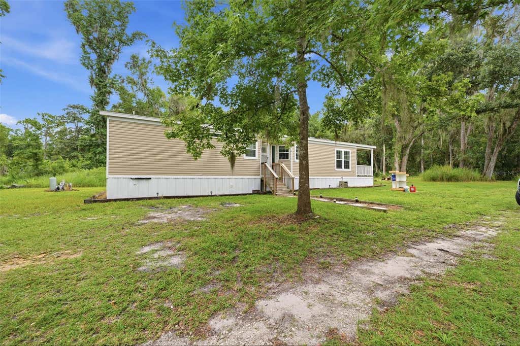 Photo of 16184 Paxford Lane, Brooksville, FL 34601 (MLS # W7887670)