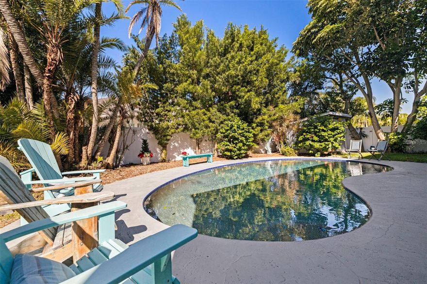 Experience true Florida living in this coastal, move-in ready, high & dry, two-story home located in Tierra Verde’s highly sought-after Sands Point neighborhood. Set in a quiet yet very vibrant and active waterfront community, this residence offers comfort, privacy, and peace of mind, having remained completely dry through the recent hurricanes. The welcoming, light blue front door opens to soaring ceilings with exposed beams, wood-look luxury vinyl floors, and abundant windows that fill the home with natural light. A sliding door connects seamlessly to the pool area, creating an easy indoor-outdoor flow. The main upper level offers a spacious living room featuring a wood-burning fireplace and a cozy formal dining corner, blending into the stunning updated kitchen. The kitchen showcases elegant countertops, ample cabinet space, and a sleek island that connects the dining and kitchen areas while offering convenient casual counter seating. Around the corner a spacious guest bedroom with dramatic ceilings, a full closet, and a beautifully updated bath. The expansive primary suite on the east side features an office nook or space to expand the already generous walk-in closet, plus a stunning ensuite bath with an oversized walk-in shower. The lower level is accessible via staircase and offers another private bedroom with ensuite bath. There is a bonus family/playroom with walkout access to the pool, and a two-car garage with laundry area, an additional refrigerator, water softener, and plenty of storage. In addition to the garage parking, the large driveway provides convenient space for multiple cars, perfect for extended family and guests. Out back, enjoy a fully fenced oasis with in-ground pool, ample space for entertaining, a setup ideal for an outdoor entertaining kitchen, plus a shed tucked in the corner for tools and water toys. The landscaping is low-maintenance, lush, and private, perfectly embracing the Florida lifestyle.
This property is also ideally located—just a five-minute bike ride on the local trail to the sandy white beach of Fort DeSoto, and the dog park. Located less than 15 minutes to downtown St. Petersburg, with easy access to I-275 and only 40 minutes to Tampa International Airport. You’re also within walking distance to Island restaurants and local shops and many local fishing spots. Schedule your private showing today!
Stylish, comfortable, and thoughtfully updated—this is a home that truly feels like home.