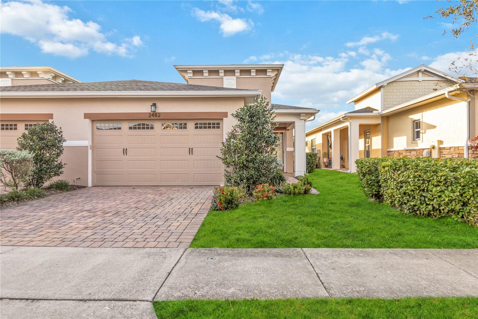 Welcome home to this Absolutely Beautiful Amelia floor plan located in the well sought after Gated 55+ Active Del Webb Twin Lakes community. With a water view. Walk into the breathtaking property featuring stunning custom glass insert in the front door, wood plank tile flooring and custom crown molding throughout. Upgraded kitchen Cabinets with custom molding, subway tile backsplash, Island features custom subway tiles, walk-in pantry, custom granite edged countertops, pendant lights, and chandelier. The living room features custom blinds. Sliding glass doors lead to screened in Lanai with custom ceiling fan & light to enjoy your morning coffee and view of the water. Master bedroom with blinds, trey ceiling, and ceiling fan. The master bedroom bathroom features custom glass doors, diamond shaped flooring in the shower, and custom tiling. Double vanity quartz edged countertops, brush Nickel hardware. Large, carpeted walk-in closet. Laundry room tailored with upgraded upper cabinets as well as lower cabinets for great storage, tile flooring, and beautiful granite countertops. Guest bedroom ceiling fan with light and faux wood blinds. Amenities include a Resort style pool, Lap Pool and 3rd pool on the carriage house side, 20,000 square foot Gorgeous Clubhouse, State of the art Fitness Center, Flex room, Tennis Courts, Putting Green, Walking Trails, Pickle Ball Court, Fishing, and Pontoon Boats and Jon boat to use on Live Oak Lake! The community has many active and socializing activities. View today!
