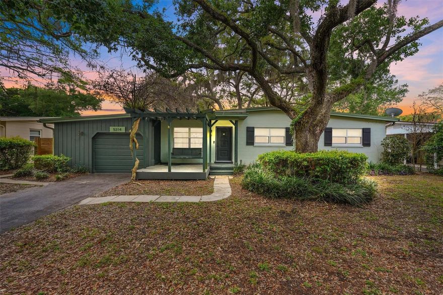 One or more photo(s) has been virtually staged. Charming Bungalow in the Heart of Curry Ford West
Welcome to this beautifully renovated bungalow, nestled on a quiet street in the desirable Curry Ford West neighborhood. As you approach the home, you'll be greeted by a charming front porch canopied by Bougainvillea complete with a swing, perfect for enjoying peaceful evenings. 
Step inside, and you'll find a warm and inviting atmosphere highlighted by original hardwood floors that flow throughout  the home. The office space, featuring stylish LVP flooring, provides an ideal space for productivity, or a flex space for your favorite activity. The kitchen is a true highlight, boasting a fun retro wallpaper, coffee bar and modern design with spacious cabinetry, tile flooring, and a fantastic view of the outdoor space. Equipped with newer appliances, including a range and dishwasher both from 2024, as well as a refrigerator from  2022, this kitchen is ready for all your culinary adventures.
As you make your way through the home, you'll notice the beautifully updated bathrooms, featuring contemporary fixtures and tile work that enhance the overall aesthetic. The interior has been thoughtfully upgraded with new doors, knobs, light fixtures, and recessed lighting throughout, creating a cohesive and stylish feel. The HVAC system, upgraded in 2017, ensures comfort year-round, while the roof, replaced in 2021, provides peace of mind.
Outside, the large backyard is perfect for entertaining, featuring plenty of space for gatherings and relaxation under the sun. The one-car garage offers not only parking but also versatility—it can easily be transformed into a home gym or workshop. The neighborhood is quiet and friendly, making it an ideal place to call home.
Living in Curry Ford West means you have access to fantastic community amenities. Just a stone’s throw away, you’ll find Dover Shores, where you can enjoy a community pool, pickleball courts, and indoor basketball courts—all for free! With Aldi and Publix grocery stores less than a mile away, shopping couldn't be more convenient. For a taste of local flavor, hop on your bike and explore the Hourglass District, where you're just minutes from beloved spots like Hourglass Brewing, Pizza Bruno, and Foxtail Coffee.  Don’t miss this must see bungalow and schedule your showing today!