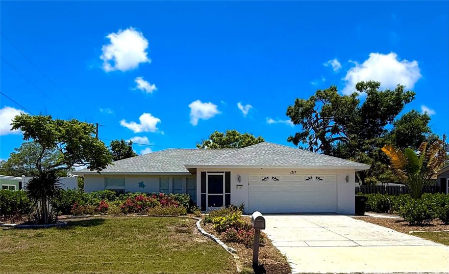 Welcome to your own slice of paradise in the heart of Venice! Perfectly positioned just minutes from charming downtown Venice and some of Southwest Florida’s most breathtaking beaches, this beautifully updated 3-bedroom, 2-bath home offers the ideal blend of comfort, flexibility, and coastal living.

Built in 2002, the home features soaring vaulted ceilings, abundant natural light, beautiful plank tile flooring throughout, and a newer roof less than four years old. The spacious open-concept kitchen is truly the heart of the home, showcasing an oversized quartz island, sleek stainless steel appliances, and plenty of space for entertaining family and friends.

One of the home’s standout features is its flexible layout. Currently configured with a private in-law suite complete with a second kitchen area and separate hurricane-rated entrance, the space offers incredible possibilities for multigenerational living, guests, a private office, or additional income potential.

Step outside and discover your own tropical oasis. Lush landscaping surrounds the property with mature privacy hedges and an impressive collection of fruit-bearing trees and vines, including mango, avocado, orange, cherry, and grapes—creating a peaceful backyard retreat unlike anything else on the market.

Live the Florida lifestyle you’ve been dreaming of with easy access to the Legacy Biking Trail, nearby pickleball courts, golf courses, Pinebrook Park walking trails, and world-famous Gulf Coast beaches. Spend your days collecting shark teeth at Caspersen Beach or enjoying unforgettable sunsets over the Gulf.

Convenience meets peace of mind with Sarasota Memorial Hospital less than 3 miles away, plus Publix, Walgreens, dining, and everyday essentials all within a half-mile walk. Best of all: NO HOA fees and NOT located in a flood zone.

Just 1 mile to historic downtown Venice, approximately 2 miles to Venice Beach, 4 miles to Nokomis Beach, less than 5 miles to Caspersen Beach, and under 9 miles to Manasota Beach.

This is more than a home — it’s a rare opportunity to embrace the relaxed coastal lifestyle that makes Venice one of Florida’s most sought-after destinations.