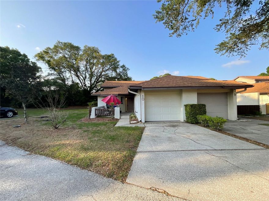 Priced to sell! This end unit villa is ready for you to put your personal touch on it. Split bedroom plan and features an contemporary style courtyard in front and an enclosed porch in back. Eat in kitchen.  Dining/living room combo.  Open floor plan. Single car garage. Plenty of guest parking. Easy access to interstate, shopping, restaurants and medical facilities makes this a great find. Buyer to verify all room measurements. Perfect home if you are ready to down size or make this your winter get-a-way. Schedule your showing today before the snow bird swoop this one up!