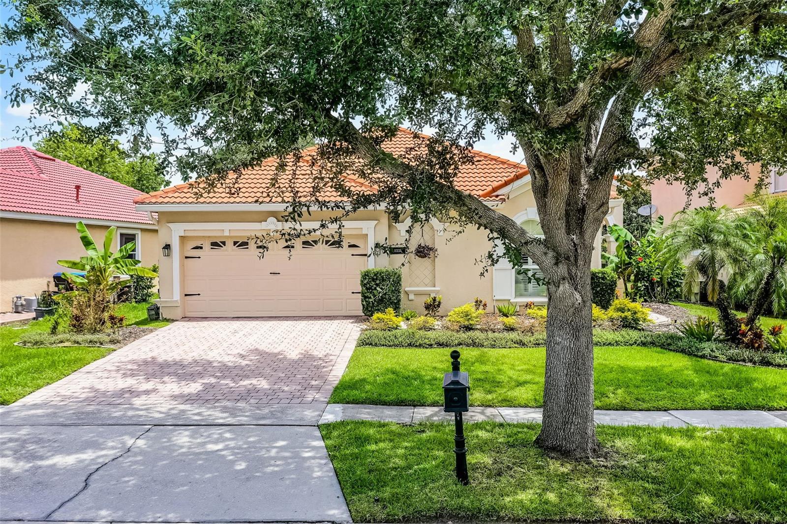 Welcome to 11337 Via Andiamo, a beautifully maintained Mediterranean-style residence nestled within the gated community of Belmere Village in Windermere. This elegant 4-bedroom, 2-bath home is filled with natural light, soaring ceilings, a newer AC (2022) and an open-concept layout that creates an airy, inviting atmosphere throughout. Thoughtfully designed for both comfort and style, the home features a spacious living and dining area that flows effortlessly into the heart of the home—the gourmet kitchen. Here you'll find 42-inch cabinetry, granite countertops, stainless steel appliances, and a cozy breakfast nook that overlooks the lush backyard.
The bright and breezy feel continues into the luxurious primary suite, which includes a tray ceiling, walk-in closet, and an updated en-suite bath with dual vanities and a modern tiled shower. Three additional bedrooms share a well-appointed full bath, and the entire home boasts tile and laminate flooring—no carpet—making it as practical as it is beautiful.
A true highlight of this property is the expansive, covered lanai. Fully screened and generously sized, this outdoor living space offers a peaceful retreat perfect for entertaining, dining al fresco, or simply enjoying your morning coffee in the shade. It seamlessly extends the interior living area and invites you to relax and unwind while taking in the serene garden views.
Located in one of Windermere’s most desirable communities, residents of Belmere Village enjoy access to resort-style amenities including a clubhouse, pool, fitness center, tennis and basketball courts, and playgrounds. With close proximity to top-rated schools, Winter Garden Village, and easy access to major highways and Walt Disney World, 11337 Via Andiamo offers a rare blend of luxury, comfort, and convenience. This light-filled, indoor-outdoor sanctuary is ready to welcome you home.