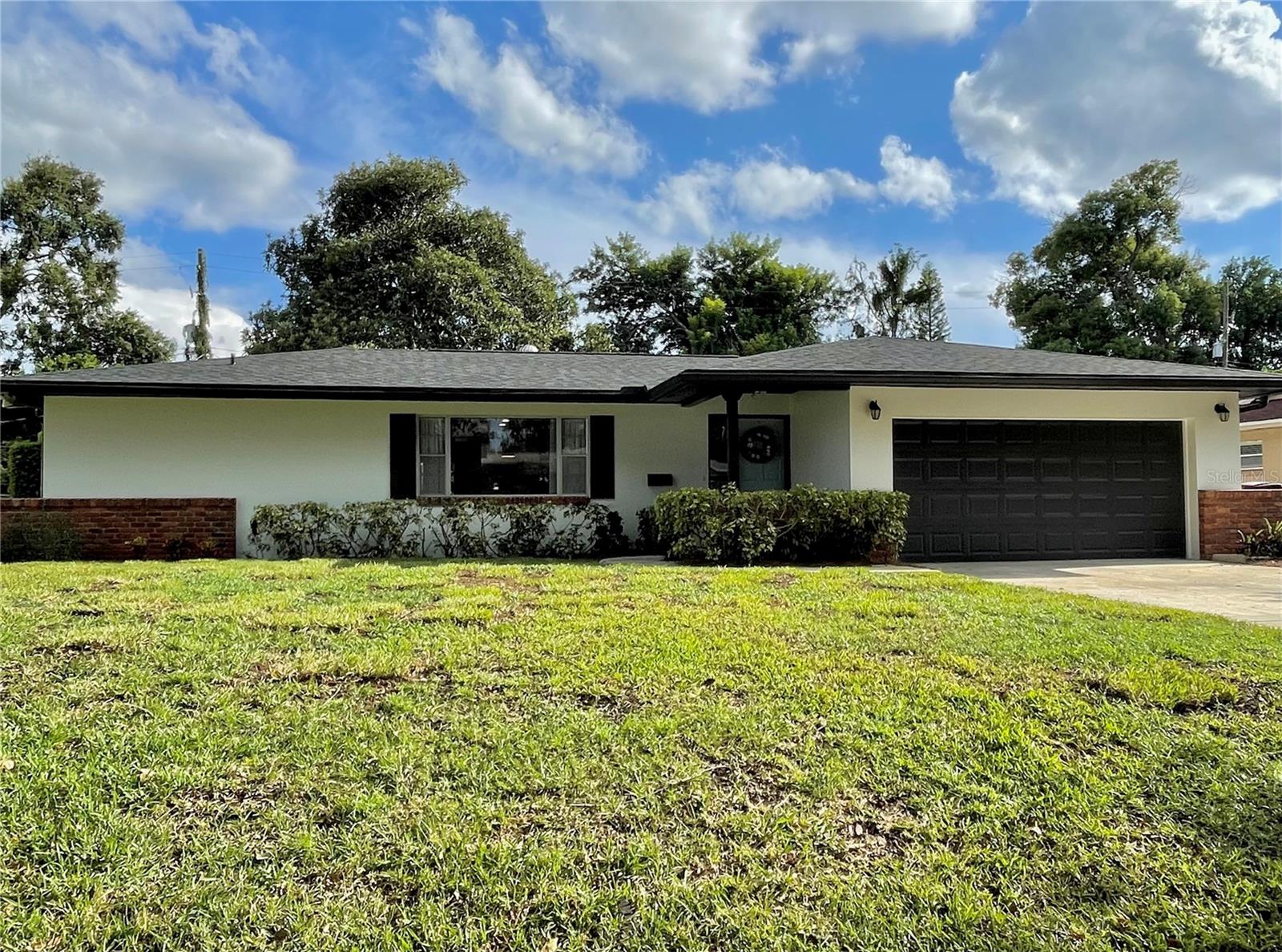 This beautiful 4 bedroom, 2 bath, split-plan home is a unique opportunity in the Lake Como area. The central location has easy access to downtown Orlando while tucked away on a quiet, tree-lined street. Anything you need is a short distance away—SR 408 (0.75 Miles), Downtown Orlando and SODO (2.5 Miles), Lake Como School K-8 (0.3 Miles), Boone High (2 Miles). The Hourglass district and Curry Ford West district Michelin-rated restaurants are also just around the corner. Optional HOA offers access to a lakefront lot on Lake Arnold. With a spacious layout, this residence offers versatile living areas, perfect for both relaxation and entertaining. The modern kitchen has a double peninsula layout and stylish fixtures. The home also features a dedicated laundry room with extensive, new cabinets. The large screened patio overlooks the beautiful yard and garden. Don’t miss this incredible home!