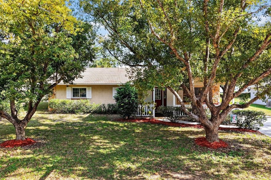 HURRY TO MAKE THIS YOUR HOME FOR THE HOLIDAYS! Welcome home to 109 N. Bloxam Ave, this charming 4-bedroom/2-Bath home with 1,920 sq. ft. in Minneola with NO HOA and an amazing layout. NEW ROOF COMING SOON! This home has great curb appeal with its mature trees and a welcoming oversized front porch. Situated on a partially fenced lot, there is plenty of room between you and your neighbors with room to grow. Inside you will find a spacious living room with plenty of space to entertain your friends and family. Kitchen is huge and features granite countertops, stainless steel appliances with a gas range, with plenty of cabinet and counter space for all your kitchen needs. The butcher block Kitchen island provides eat-in dining space that is wheelchair accessible. The dining room has sliding doors providing access to the side and rear yard. This lovely residence features a split bedroom layout with four nicely sized bedrooms. Guest bathroom has a dual vanity, a walk-in shower plus a separate garden tub for relaxing. Your laundry room is conveniently located in the guest bathroom, includes the washer and dryer.  Additionally the home offers a detached workshop/utility shed for all of your tools and additional storage. Call today to schedule your private tour! Walking distance to great schools, Minneola Trailhead park/bike trail which is part of the South Lake bike Trail, plus close proximity to Downtown Clermont's Waterfront Park, Orlando Health South Lake Hospital, and the new Minneola Advent Hospital. The Minneola Turnpike ramp is just 3 miles away!