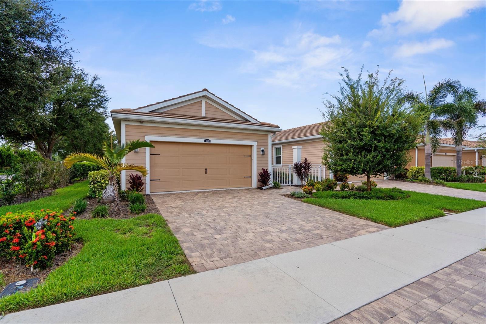 Welcome to this beautifully updated and partially furnished villa in the highly desirable gated community of Renaissance at Wellen Park. This 2-bedroom, 2-bathroom home with a versatile den offers comfort, elegance, and a lock-and-leave lifestyle just minutes from Downtown Wellen Park and the Braves Spring Training Stadium.
From the moment you step inside, you’ll appreciate the abundance of thoughtful upgrades throughout—from the crown molding and tile flooring to the custom lighting fixtures, surround sound speakers, and designer finishes that bring a warm, upscale feel to every space.
The kitchen is a standout with quartz countertops, an expansive center island, under-cabinet lighting, and a sleek mosaic backsplash—perfect for entertaining or everyday living. The open layout flows seamlessly into the light-filled living and dining areas, all overlooking a lushly landscaped, oversized screened lanai with peaceful lake views.
The primary suite is spacious and serene, offering a spa-like en-suite bath with double vanities, an oversized walk-in shower, private water closet, and generous closet space.
Another major upgrade includes the UV light system added to the AC, which enhances indoor air quality by helping to neutralize mold, bacteria, and allergens—promoting a healthier, more energy-efficient home.
Set on a prime corner lot, this villa offers both privacy and views, blending indoor comfort with outdoor tranquility.
Renaissance at Wellen Park offers resort-style amenities including a luxurious pool and spa, fitness center, tennis, pickleball, and bocce courts, walking trails, a dog park, and an on-site Activities Director to keep your social calendar full.
Partially furnished and move-in ready, this home offers the best of Florida living with modern updates and timeless charm. Come see it for yourself and fall in love with the lifestyle that awaits!
