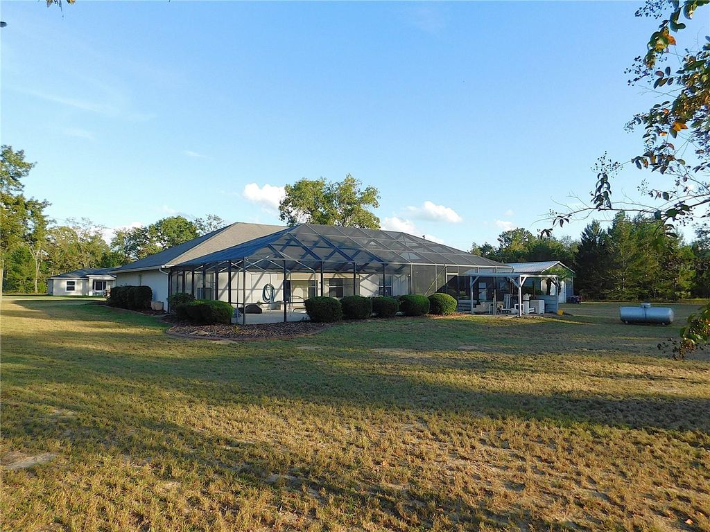 Photo of 10 Malauka Place Trail, Ocklawaha, FL 32179 (MLS # OM713193)