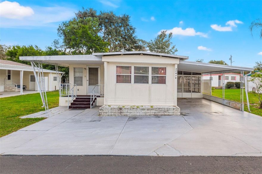 TROPICAL PARK! Neat as a pin and READY for you! Just bring your suitcases and start enjoying the Florida sunshine. This FURNISHED 2 bedroom 2 bath home has plenty of room to entertain and relax. The living room is 21 x 9.5 and the dining room is 15 x 11. Both are large and can be divided into separate spaces if you wish. Create a reading nook or craft space in the living room or have an office / desk area in the dining....possibilities are endless with this much room to roam. The kitchen has wood cabinets and an eat-in area with a breakfast table and chairs. The refrigerator, stove and microwave have been updated. The master bedroom is also roomy with space for a sitting area and a private bath. The second bedroom offers built in drawers, closet space and brand new carpet. The hall bath is spacious...it is 9 x 7 and features brand new vinyl flooring, a large vanity, medicine cabinet and tub/shower combo. The laundry room is 10 x 10...not often you find a laundry room IN the house...it's not in the shed here and it offers tons of storage, washer, dryer and even a sink. There's a 8x8 storage shed that could be the perfect workshop if you want a place to work on projects. The porch is situated between the shed and the carport and is 13 x 11. There are vinyl windows and retractable doors that slide away...if you have a golf cart you could park it here. The carport offers one covered space, one uncovered space PLUS there's a parking pad along the front of the home too. The HOA fee is LOW...only $200 per year. Per HOA rules no pets allowed except for service animals. No leasing allowed per the HOA rules. Make an appointment to see this home TODAY!