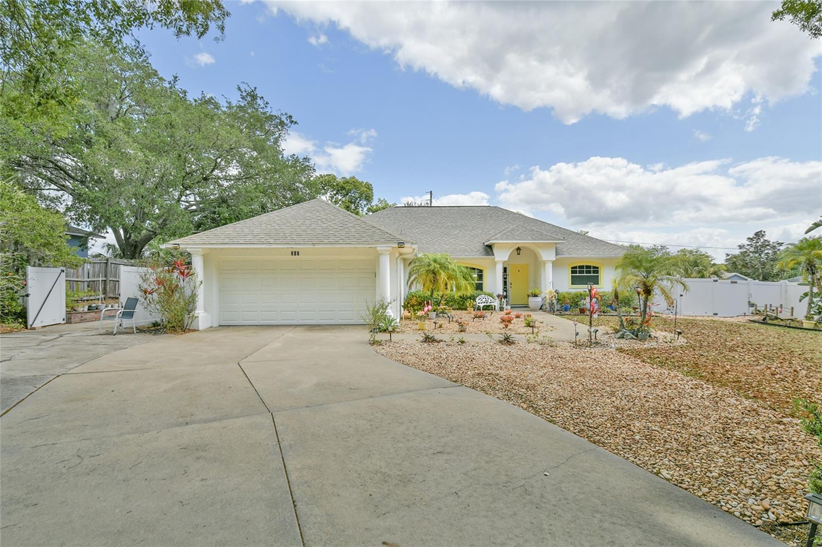 MOTIVATED SELLER!! PRICE IMPROVED! Welcome Home to beautiful and quaint Howey In The Hills! This 3 bedroom 2 bath home boasts fairly new kitchen countertops and painted kitchen cabinetry, new appliances that have smart features, an eat-in kitchen, separate dining room or additional living area. The main living/family room is adjacent to the kitchen. Ceramic tile in the kitchen and bathrooms and wood laminate flooring throughout the remainder. Home has a smart thermostat that can be controlled by your phone. Large screened back patio, fenced backyard. Extended concrete side driveway/parking pad perfect for your boat and/or RV. There is also an additional concrete pad for a small storage/gardening shed. Nice size master bedroom with his and hers walk-in closets. You are just around the corner from Little Lake Harris on the Harris Chain of Lakes offering fantastic boating and fishing with public boat ramp (small fee) and fishing pier. Just moments away is the nature preserve, lakefront park, playground, library, restaurants and nail and hair salons. Minutes from the Florida Turnpike making for easy commute to Orlando International Airport, downtown Orlando and Central Florida attractions. Close to world renowned Mission Inn Resort community, famous Yalaha German Bakery and Tavares which offers fly-in seaplanes. New Publix Center coming soon within a short drive from this home. You're sure to fall in love with the "small town" tranquil "Old Florida" feel of this community. Assumable low-rate VA loan is an option. Other creative financing available. Owner's health promotes sale, all reasonable offers will be considered.