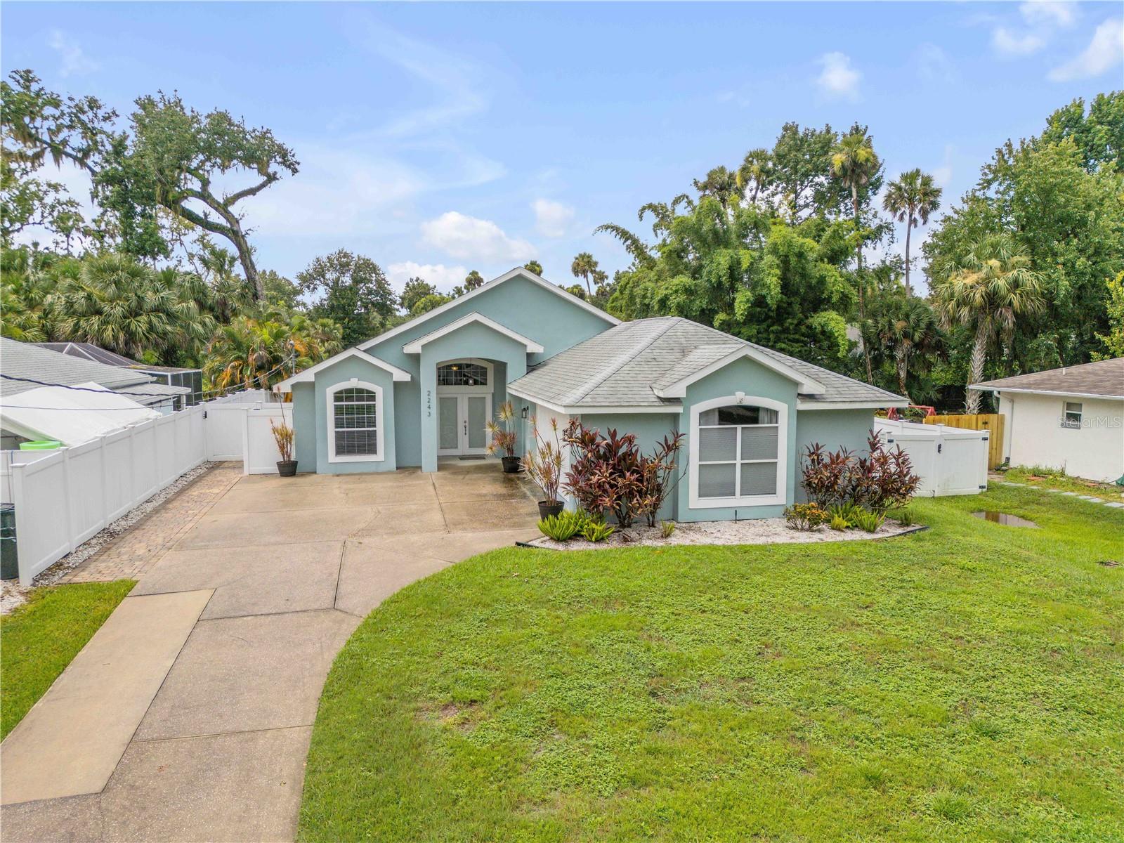 Welcome to this meticulously maintained, custom-built 3-bedroom, 2-bathroom home nestled in the highly desirable and tranquil Corbin Park neighborhood—a well-established community with no HOA fees and no through traffic. Situated on a high and dry lot, this home provides a solid foundation and plenty of space to enjoy both indoor and outdoor living.
Step inside to a bright and open floor plan, accentuated by vaulted ceilings and an abundance of natural light that flows throughout the spacious living areas. The kitchen is truly the centerpiece of the home, boasting granite countertops, custom-built cabinetry, and a functional breakfast bar that effortlessly connects to the dining and living rooms—creating an ideal space for entertaining guests or enjoying family meals.
The primary suite is a true retreat, featuring elegant French doors that open directly to the screened-in outdoor living area, offering a seamless indoor-outdoor connection. The en suite bathroom impresses with a relaxing soaking tub, a separate walk-in shower, and a generously sized walk-in closet complete with ample shelving and hanging space.
Two additional bedrooms provide comfortable accommodations with generous closet space, windows that flood the rooms with natural light, and flexible layouts perfect for family, guests, or a dedicated home office. The second full bathroom serves these rooms with a well-appointed tub/shower combination, a large vanity area, and plenty of storage options.
Outside, enjoy year-round Florida living in the expansive screened-in lanai, a perfect spot for morning coffee or evening relaxation. The lanai opens to a beautifully crafted paver patio, ideal for barbecues, outdoor dining, or simply soaking up the sun. The backyard is fully enclosed with a white vinyl privacy fence, ensuring a secure and private space for children, pets, or gardening enthusiasts, complemented by low-maintenance landscaping.
This home offers peace of mind with significant updates including a 2020 roof, a newer HVAC system, and a newer hot water heater—all helping to ensure comfort and efficiency for years to come. Inside, a dedicated laundry room with built-in cabinetry provides ample storage and convenience.
The garage is finished and air-conditioned, creating versatile space that can easily be transformed into a 4th bedroom, fitness room, workshop, or bonus living area—the possibilities are endless.
Located just minutes from beautiful beaches, shopping centers, and local dining options this Corbin Park home combines thoughtful design, quality updates, and an unbeatable location. Don’t miss this rare opportunity—schedule your private showing today!